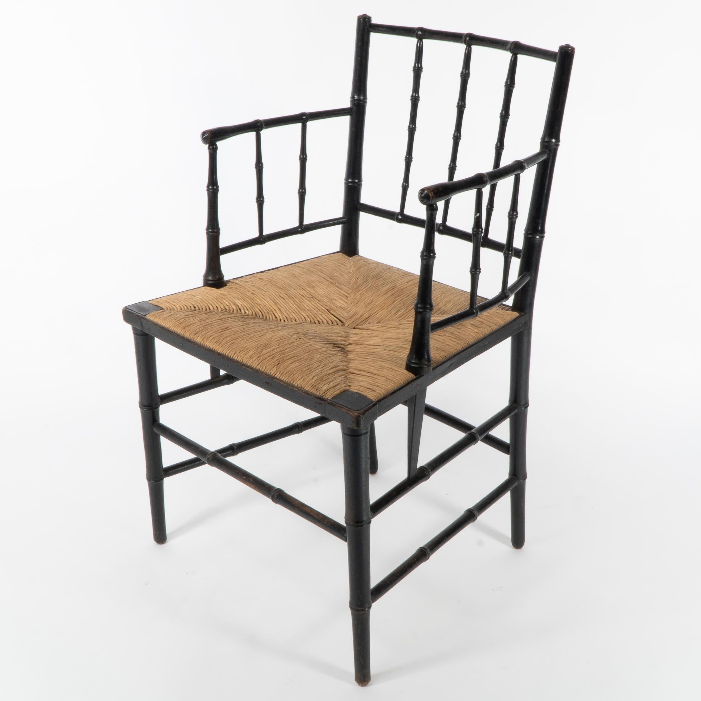English Robert W Edis, An Aesthetic Movement rush seat armchair in the bamboo style For Sale
