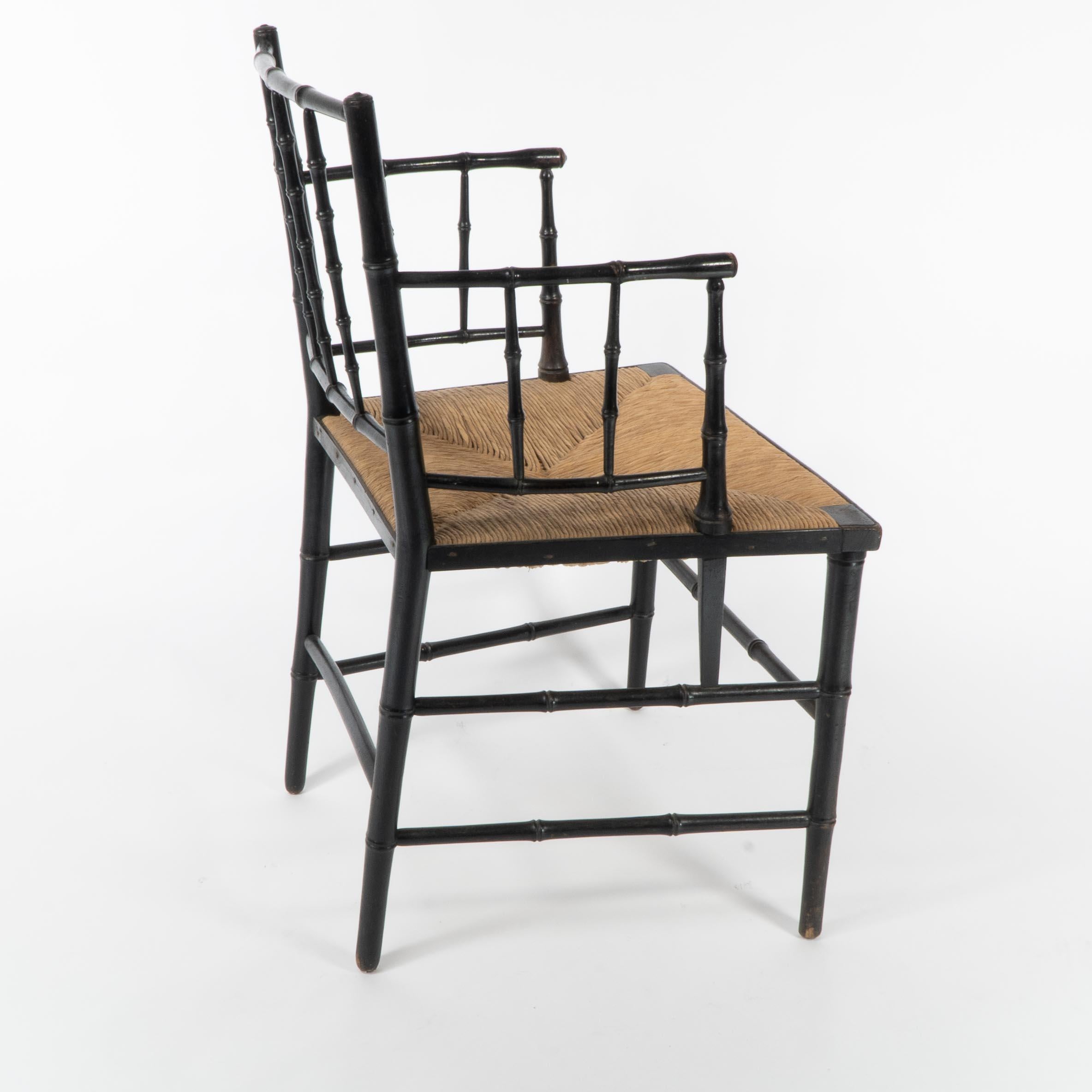 Robert W Edis, An Aesthetic Movement rush seat armchair in the bamboo style In Good Condition For Sale In London, GB