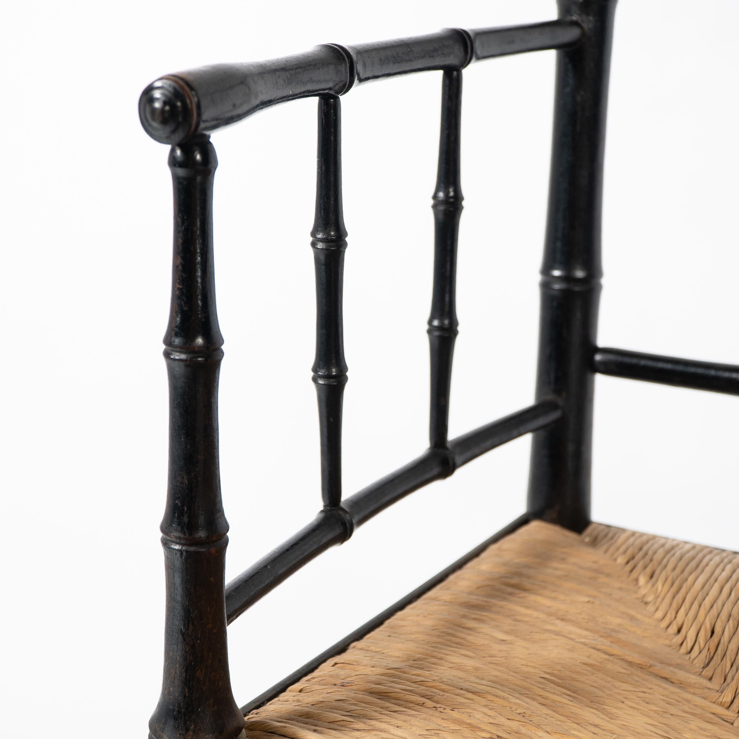 Beech Robert W Edis, An Aesthetic Movement rush seat armchair in the bamboo style For Sale