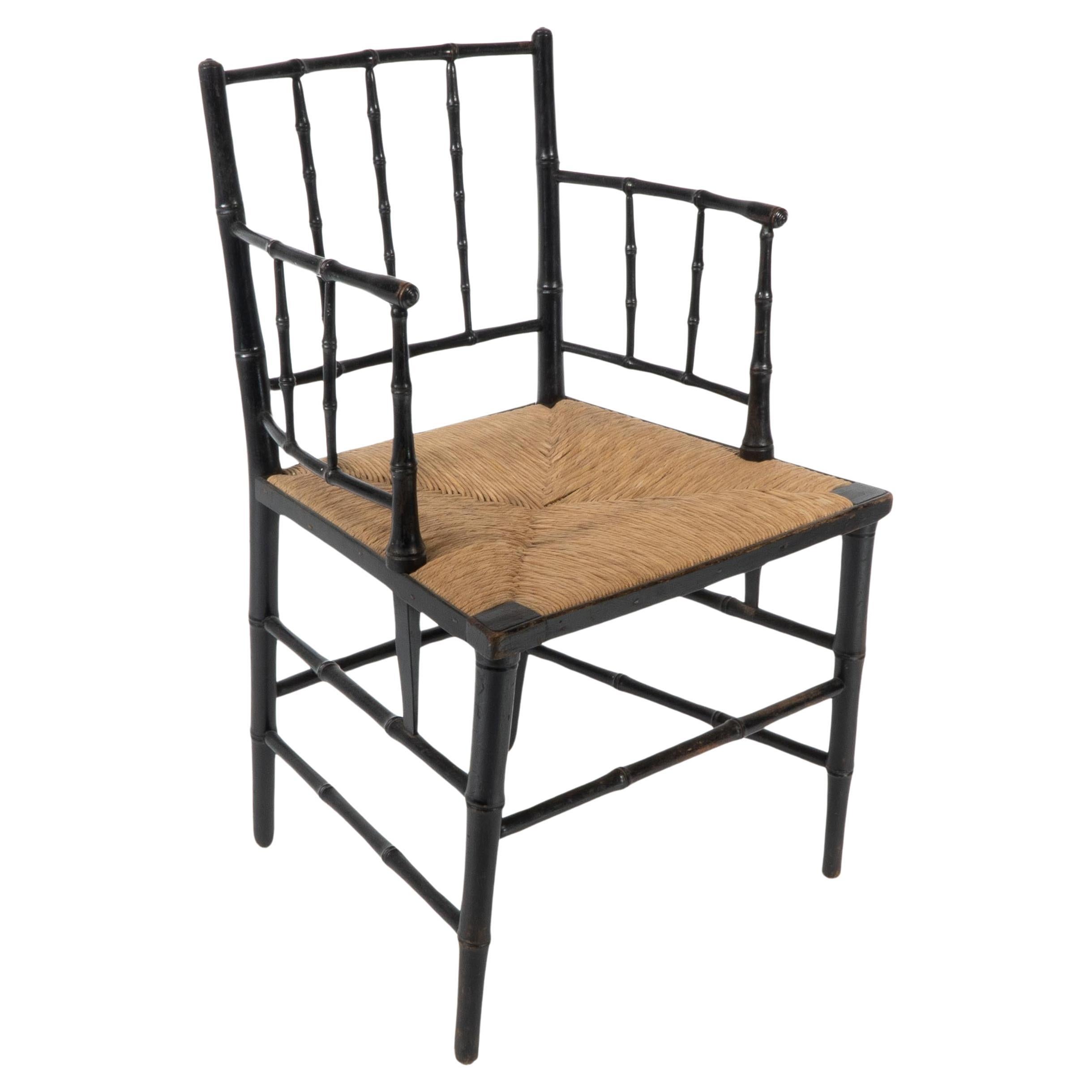 Robert W Edis, An Aesthetic Movement rush seat armchair in the bamboo style