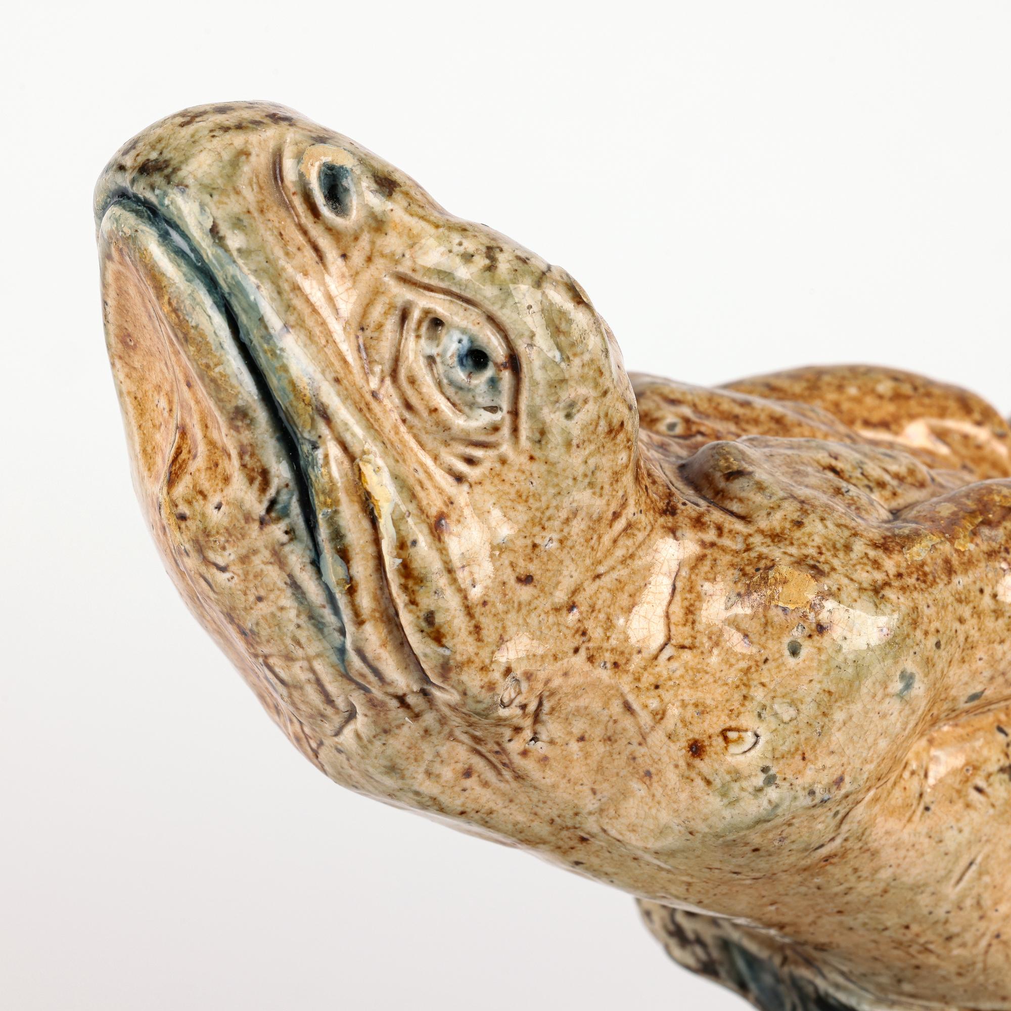 A rare and important pair of stoneware grotesque amphibious creature andirons by Robert Wallace Martin for Martin Brothers dating from the mid 1870’s. 

This pair of unrecorded figural andirons, are amongst the most unusual pieces of Martinware and
