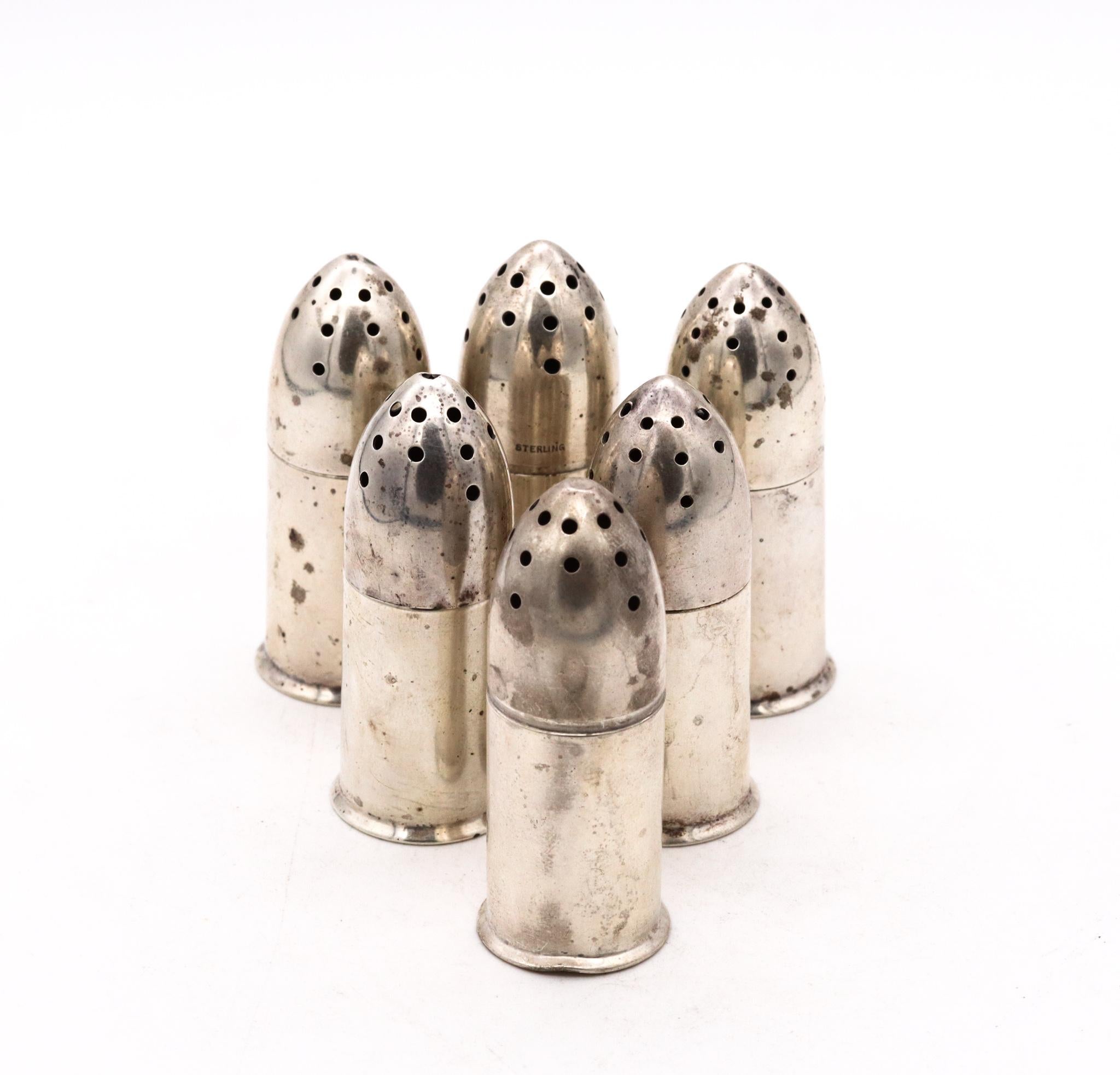 Unusual shakers set designed by Robert Wallace & Sons.

A beautiful set of 6 salt & pepper shakers, designed during the WWII period, circa 1940's. They was crafted with patriotic motifs in the shape of bullets in solid .925/.999 sterling silver,