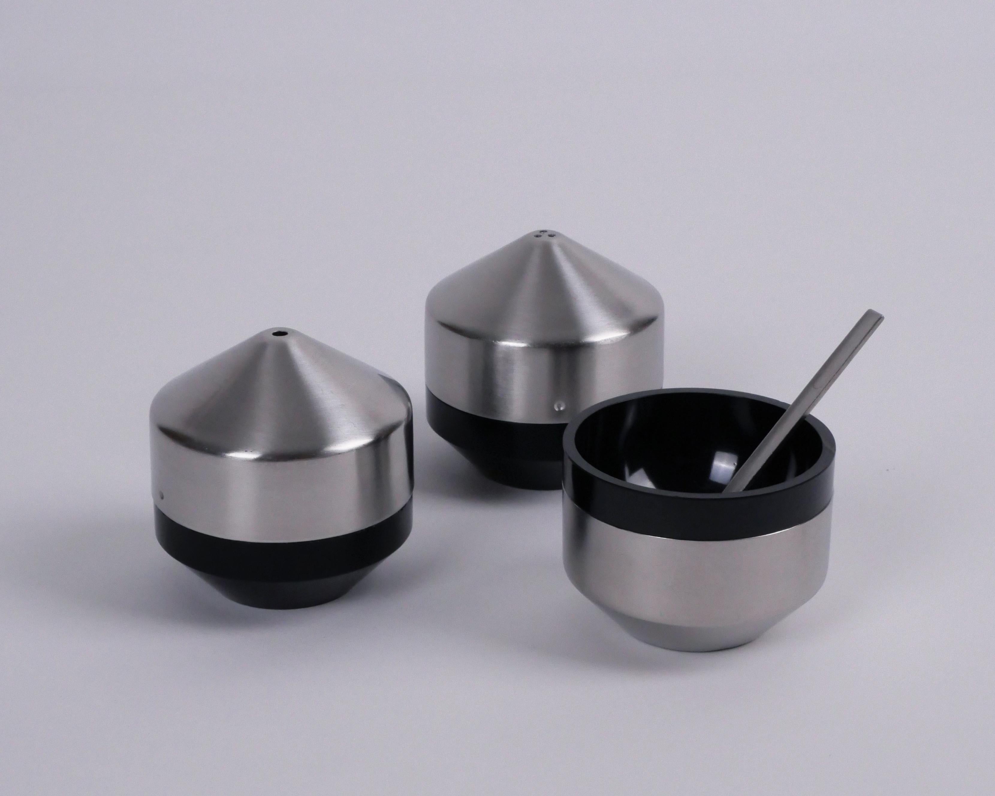 Robert Welch for Old Hall, 1962-4
'Alveston' condiment set

Stainless steel with black plastic inserts
Very good condition, with only light marks
Makers stamp to underside of each

A super, mid-century set, elegant as a display set but also