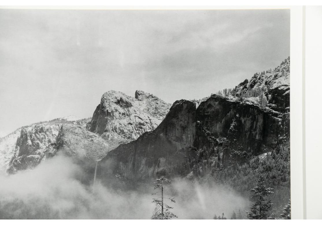 Pencil signed lower right. A mountain landscape with the mist over the forest in the winter. He is known for his mountain views in the American west
full paper Site  14 3/4” x 18 1/2