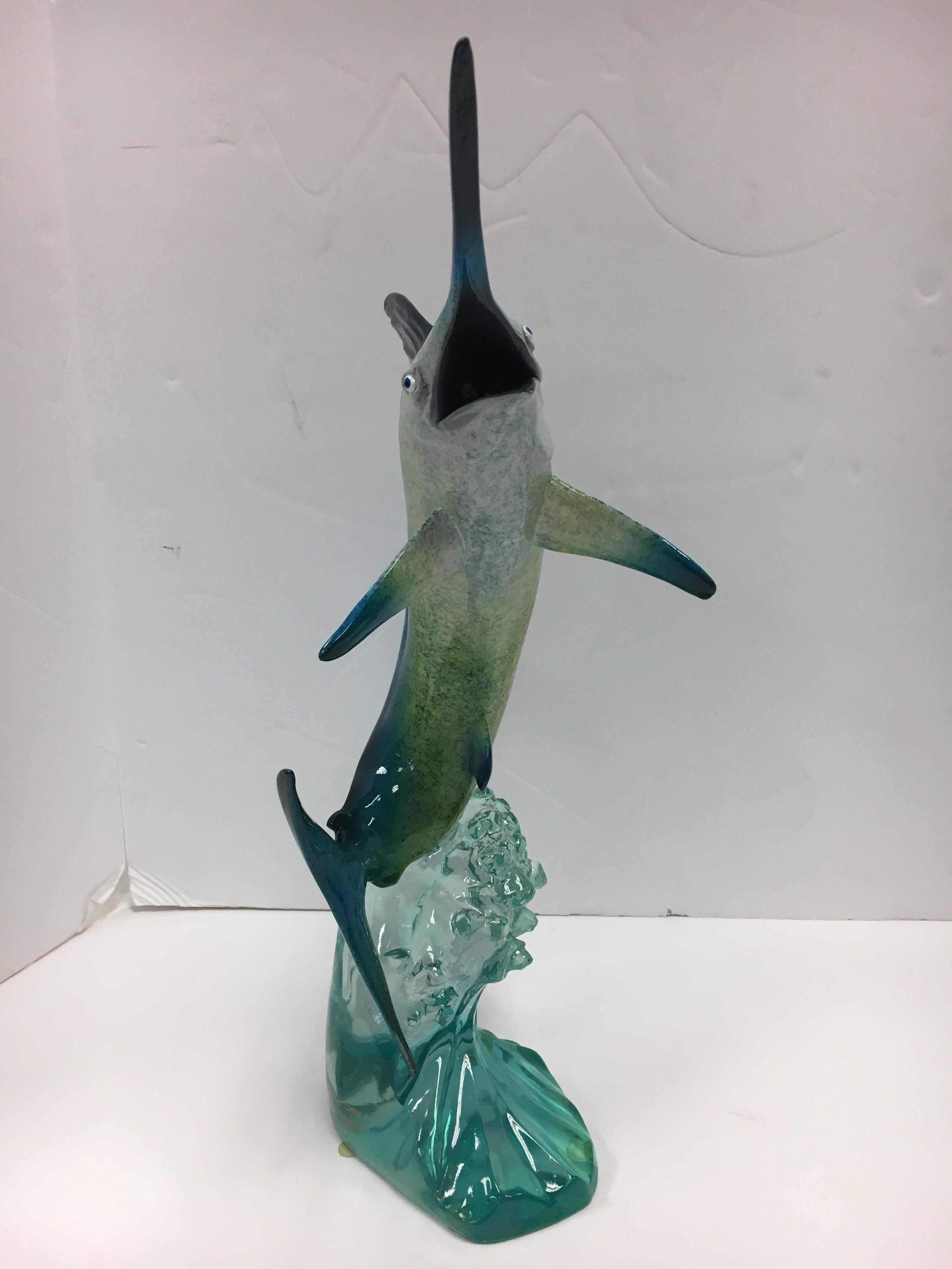 Coveted Robert Wyland marlin sculpture done in Lucite and hallmarked/signed at bottom.