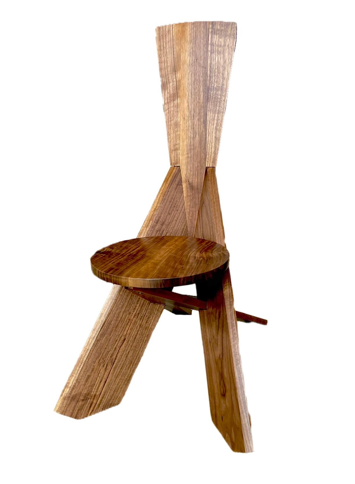 This is a one of a kind chair made by local Austin artist, Robert Wymer. 

It is made with an innovative design that is meant to get tighter and more sturdy the more it is used. It is a beautiful handcrafted, one-of-kind chair. It makes a great