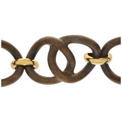 Brazalete Colección Roberta de oro amarillo de 18 quilates y palisandro