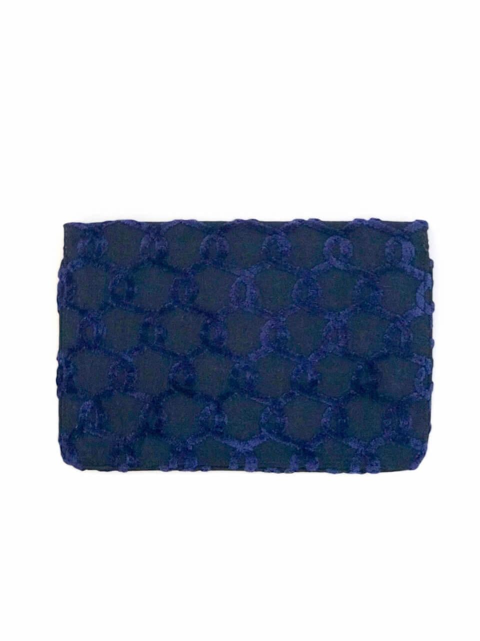 This is a chic blue Roberta di Camerino envelope clutch bag or pochette from the 1970s. The slim design features a linear silhouette and the signature Roberta di Camerino intertwining belts design in a raised gentian blue velvet on a darker navy