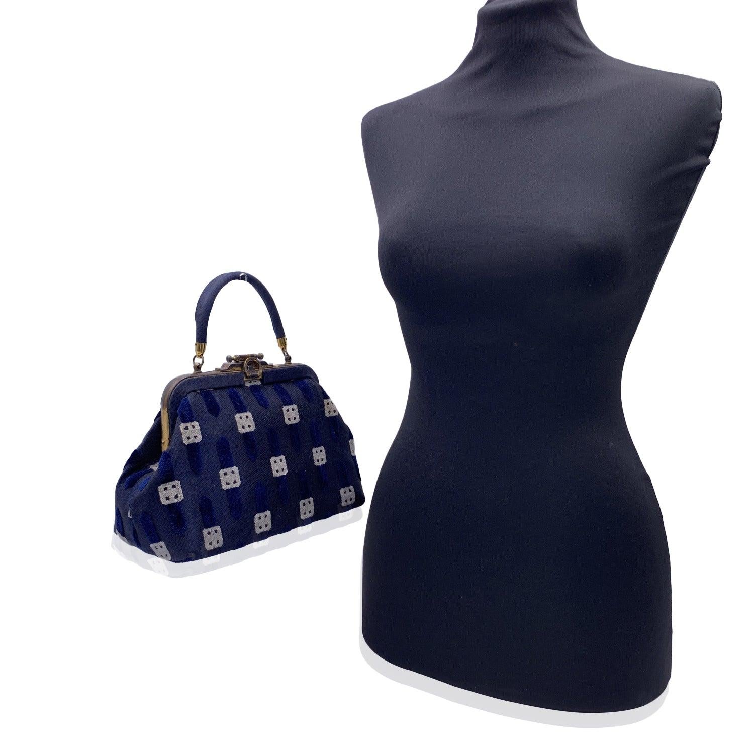 ROBERTA DI CAMERINO blue and white cut out velvet handbag. Blue fabric with cut out velvet. Beautiful shape, with gold metal frame. Push closure on top. Blue leather lining. 1 side zip poket and 2 side open pockets inside. 'Made in Italy by Roberta