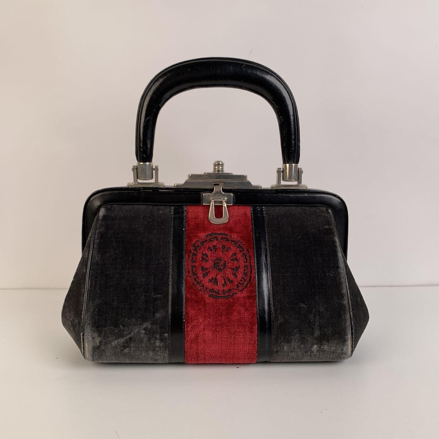 Gorgeous ROBERTA DI CAMERINO Small 'Bagonghi' Doctor Bag! Classic style in gray velvet with red cut-out 'Meridiana' design on the front. It features a leather top-handle and a push-lock closure. Leather lined interior with zipper and open pockets.