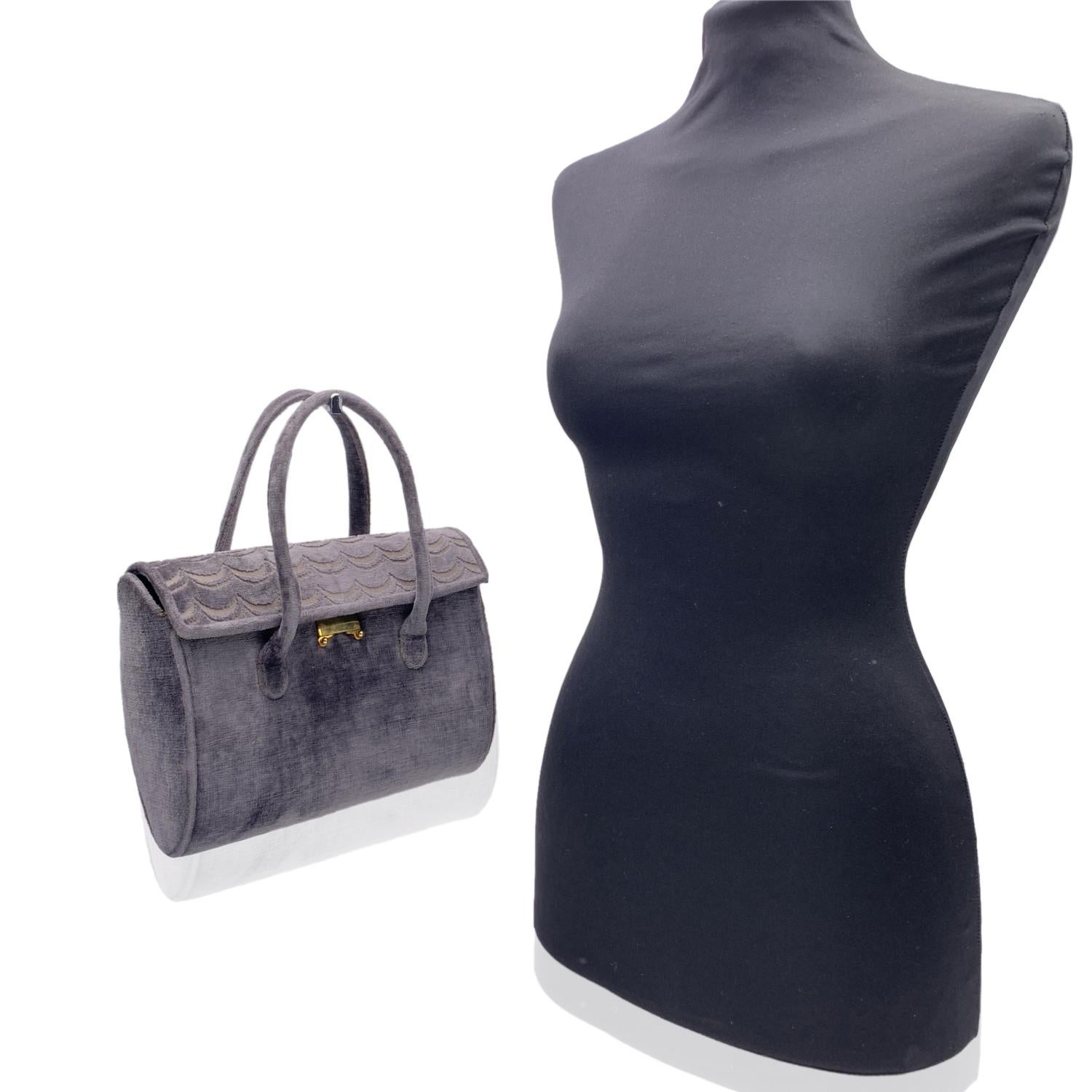ROBERTA DI CAMERINO grey velvet handbag. Double top handles. Flap with push closure on the front. Cut out motif on the flap. Black leather lining. 1 side zip pocket and 2 side open pockets. 