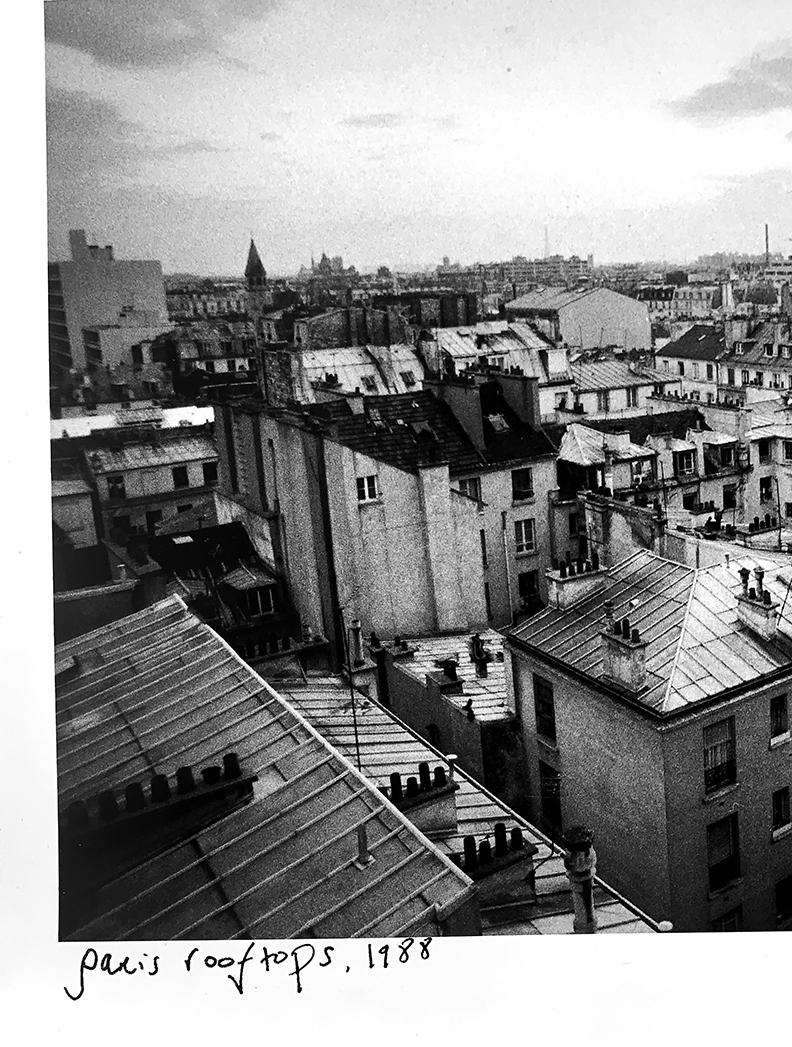 An iconic black-and-white image from the 1980s in France, a look at a rooftop vista from an 11th 
