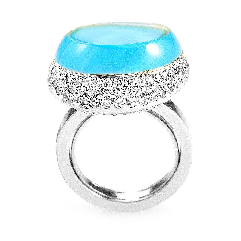 This cocktail ring from Roberta Porrati is luxurious and modern. The setting is made of 18K white gold and features a bezel set topaz. The bezel is set with ~.75ct of diamonds.

