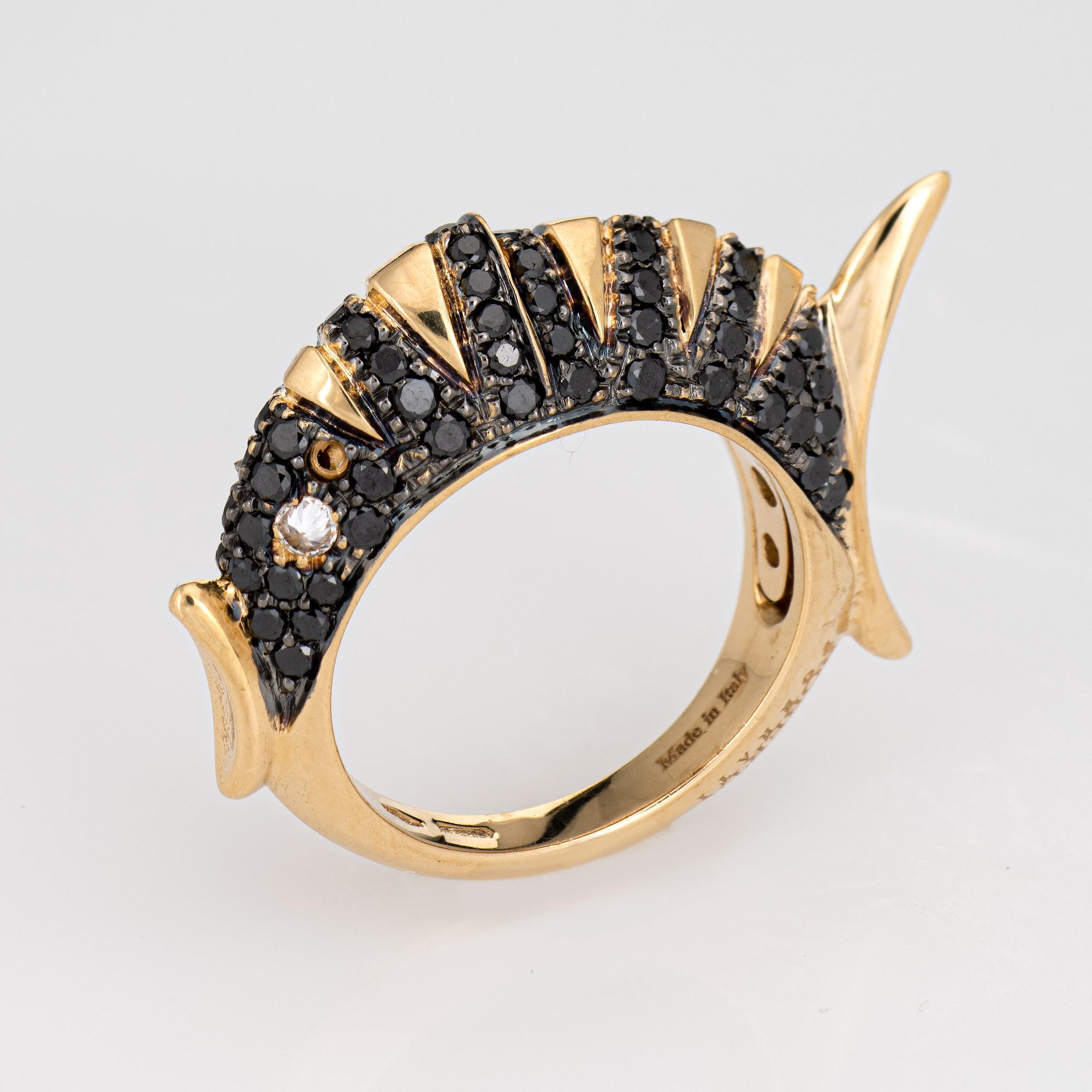 
Stylish Roberta Porrati fish ring crafted in 18 karat yellow gold. 

Black diamonds total an estimated 1 carat. Two white diamonds are set into the eyes (inverted) and total an estimated 0.20 carats.  

The distinct fish ring is set with black