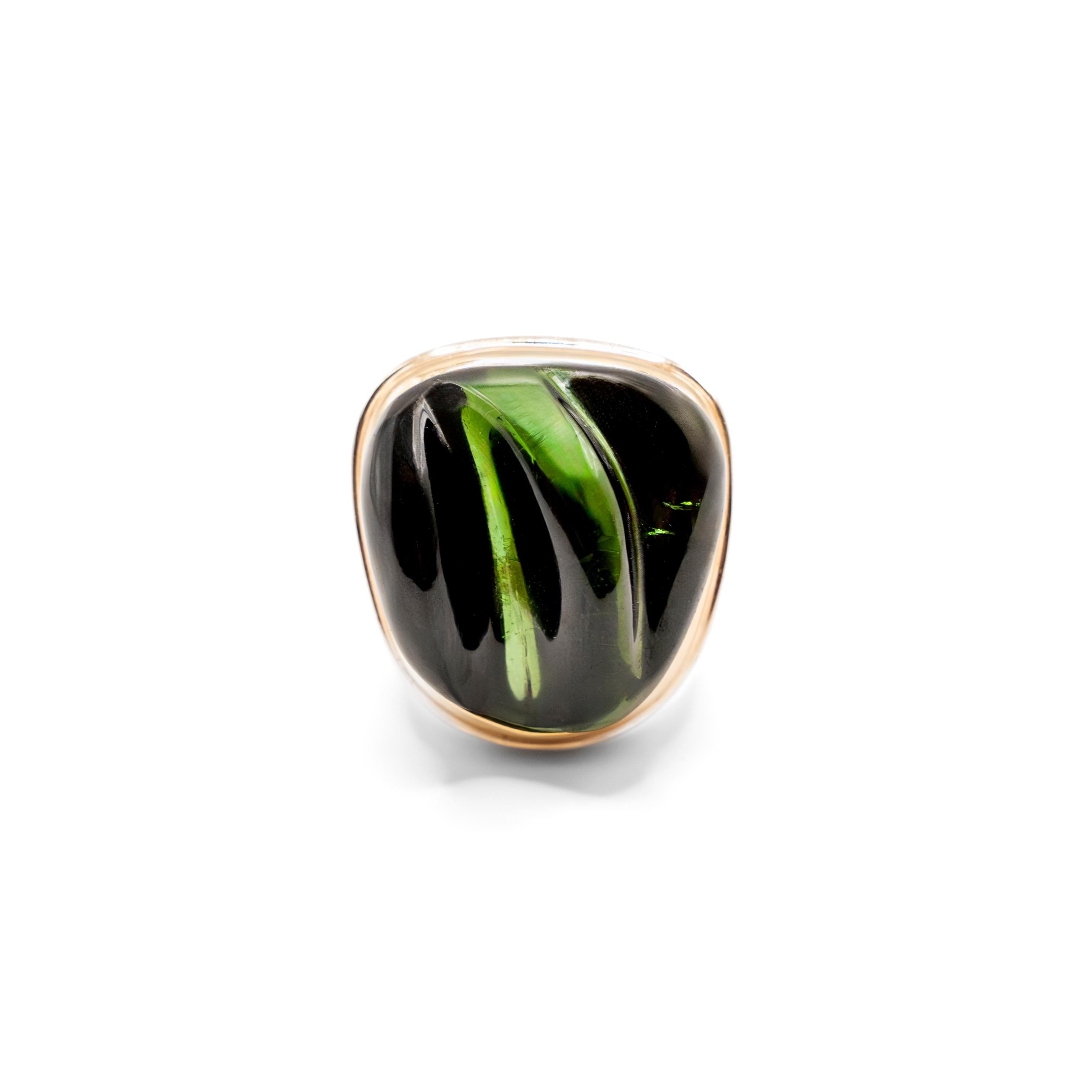 Exceptional Carved Green Tourmaline set on a signed Burle Marx 18K Gold. The yellow gold and carved green tourmaline ring in the “Forma Livre” style, a cut Burle-Marx pioneered in the mid 1950’s. Known for his inventive style and use of Brazilian