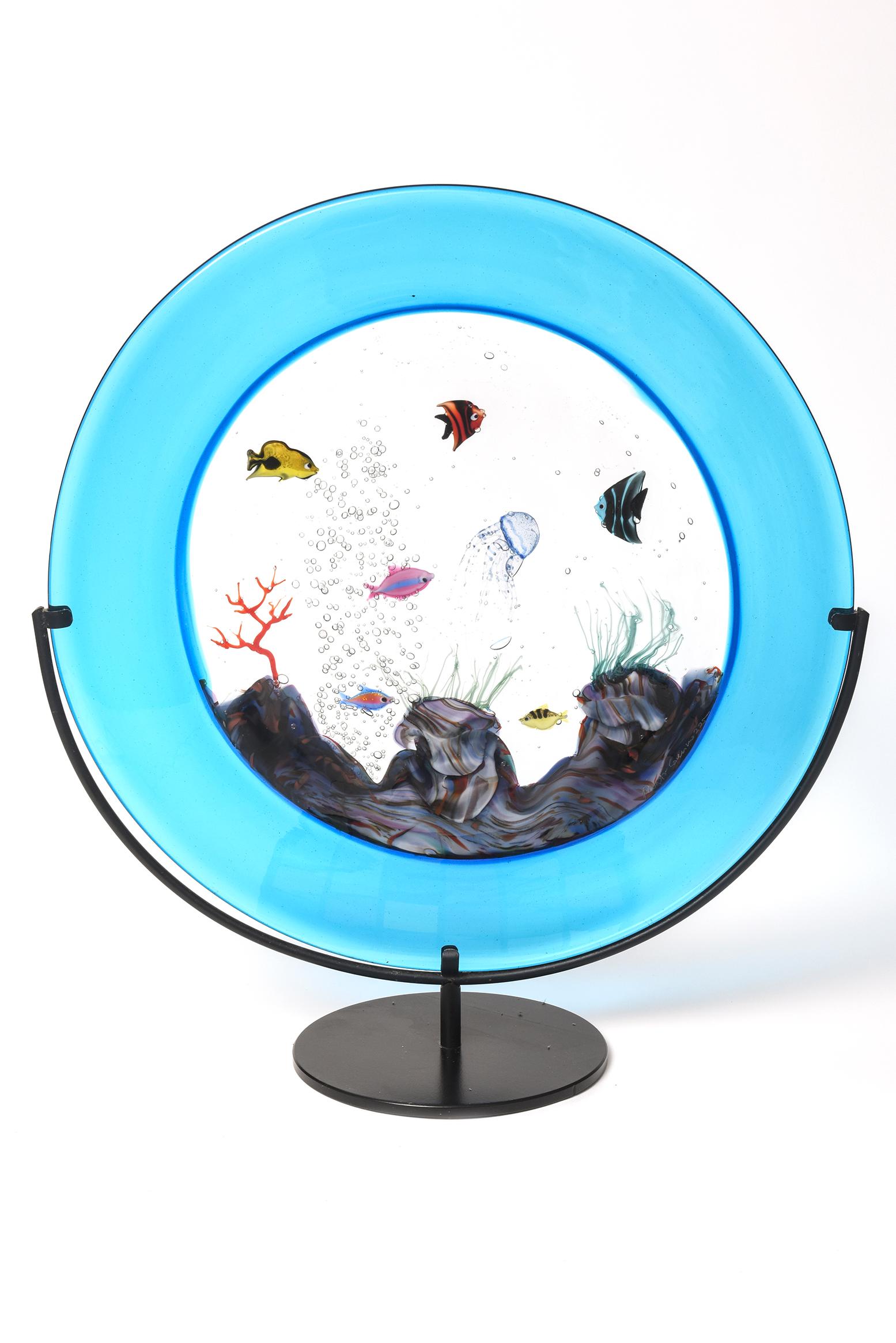 Large Murano Art Glass Sculpture Roberto Cammozzo featuring a gorgeous aqua blue color surrounding the center multicolored fish aquarium. The aquarium slides into the painted black metal stand. Glass measures without base at about 19.5
