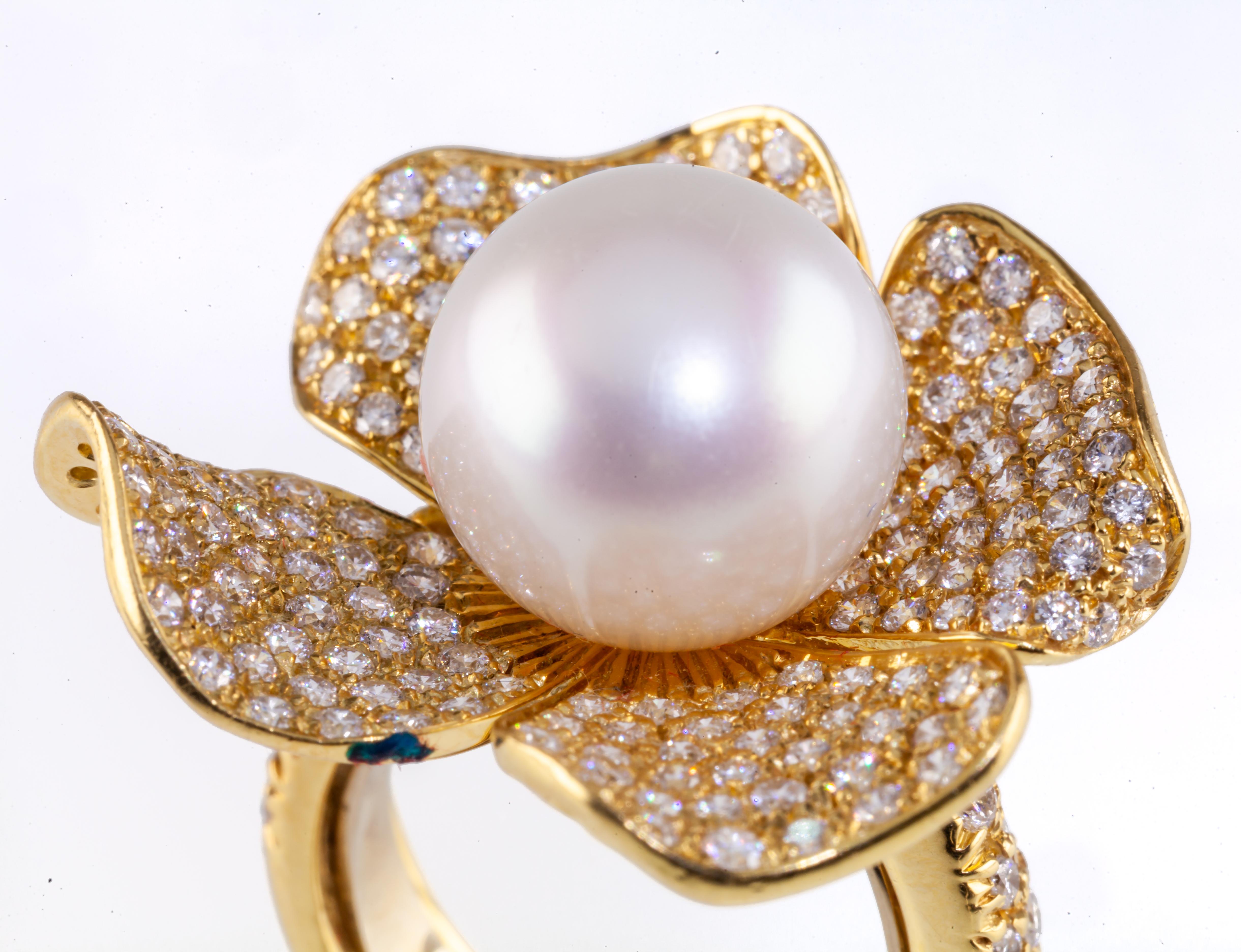 Features a single Cultured Pearl measuring Appx 12.5 mm in Diameter
Includes Appx 2.57 ct Pave Diamonds
5 mm Band
Gross Weight: 17.1 grams
Ring Size: 6.5
Marked with Italian Markings for Roberto Casarin

Reference Item #DB-1081 CM 03-27-25