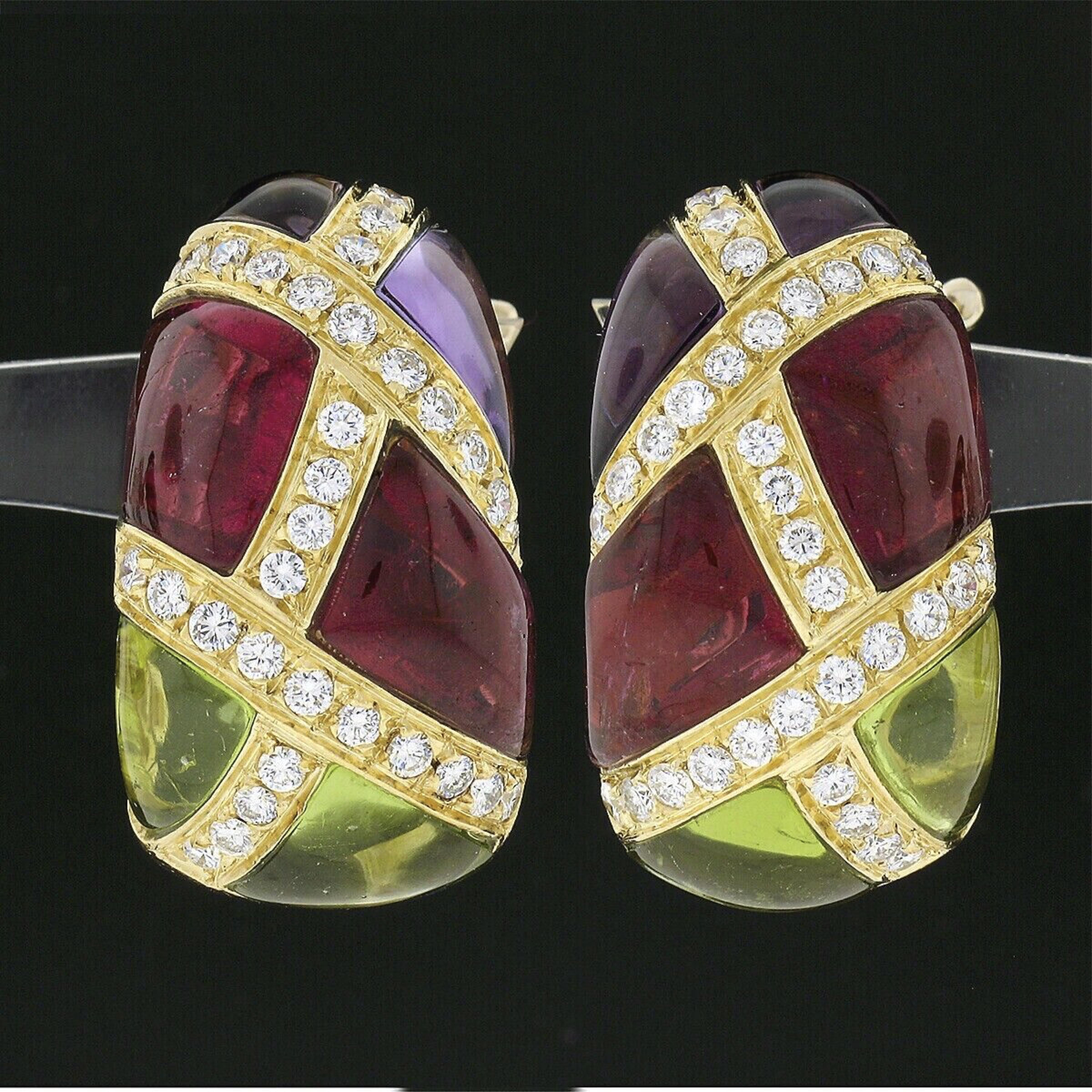 Here we have a truly unique and elegant pair of statement cuff earrings that are designed by Roberto Casarin and crafted from solid 18k yellow gold. These gorgeous earrings feature custom cabochon cut rubellite, amethyst, and peridot stones set