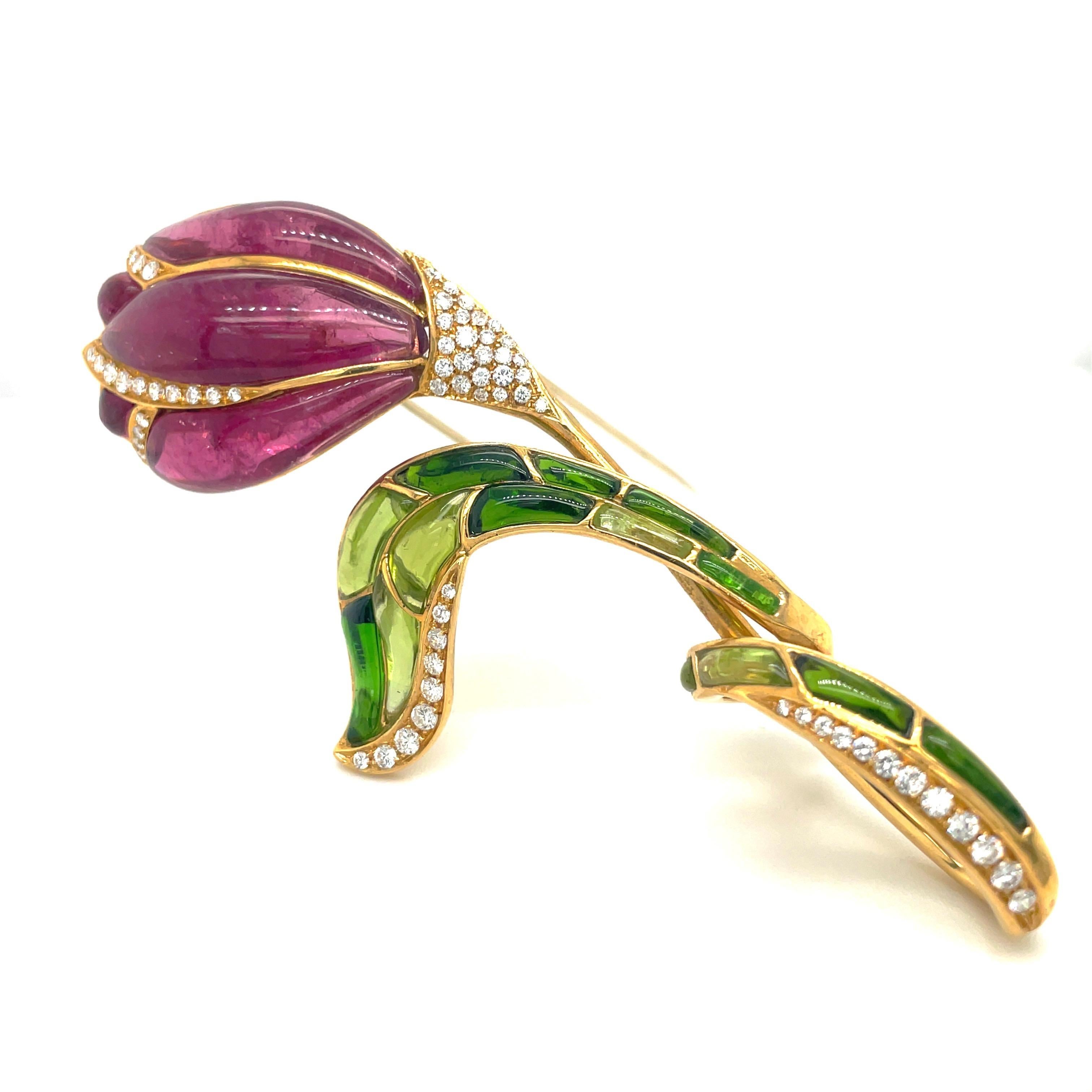 Made for Cellini by Roberto Casarin, this timeless and elegant yellow gold brooch, with natural rubelite petals, green tourmaline /peridot leaves and 1.00 carat diamond stem is the perfect brooch for any occasion. Made in Italy by Roberto