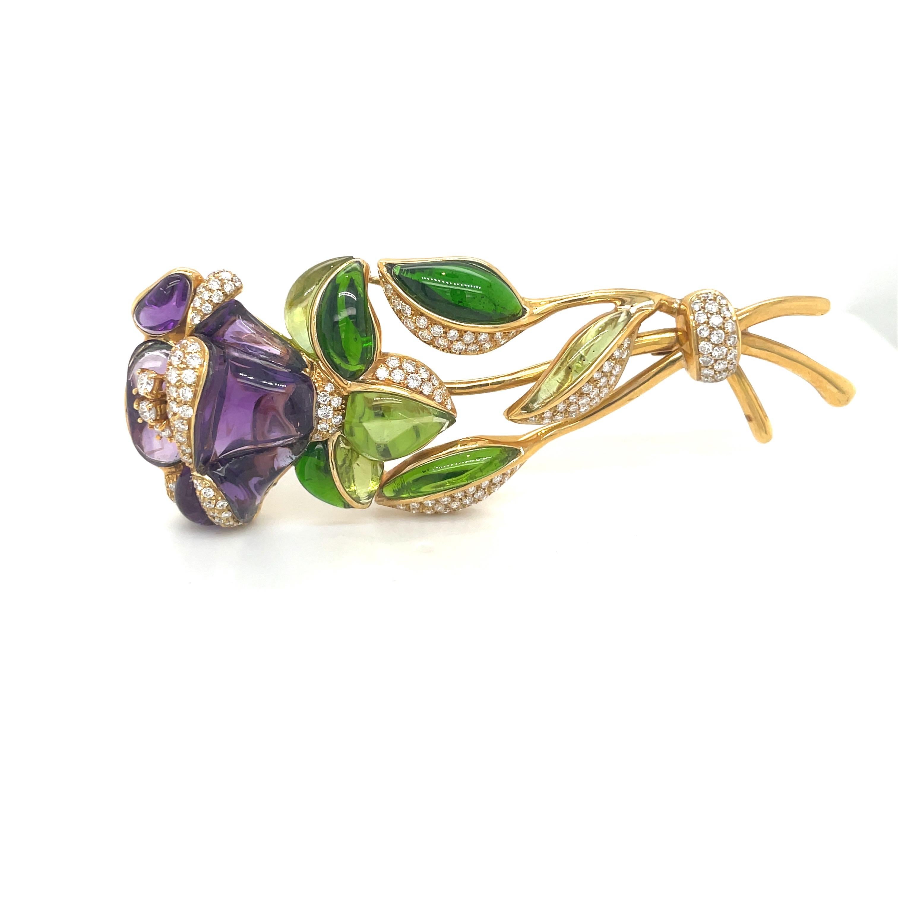 This intricate 18 karat yellow gold flower brooch was made exclusively for Cellini in Italy by Roberto Casarin. The petals are beautifully set with pave diamonds and hand carved and polished amethyst. The flower is further detailed with the bud,