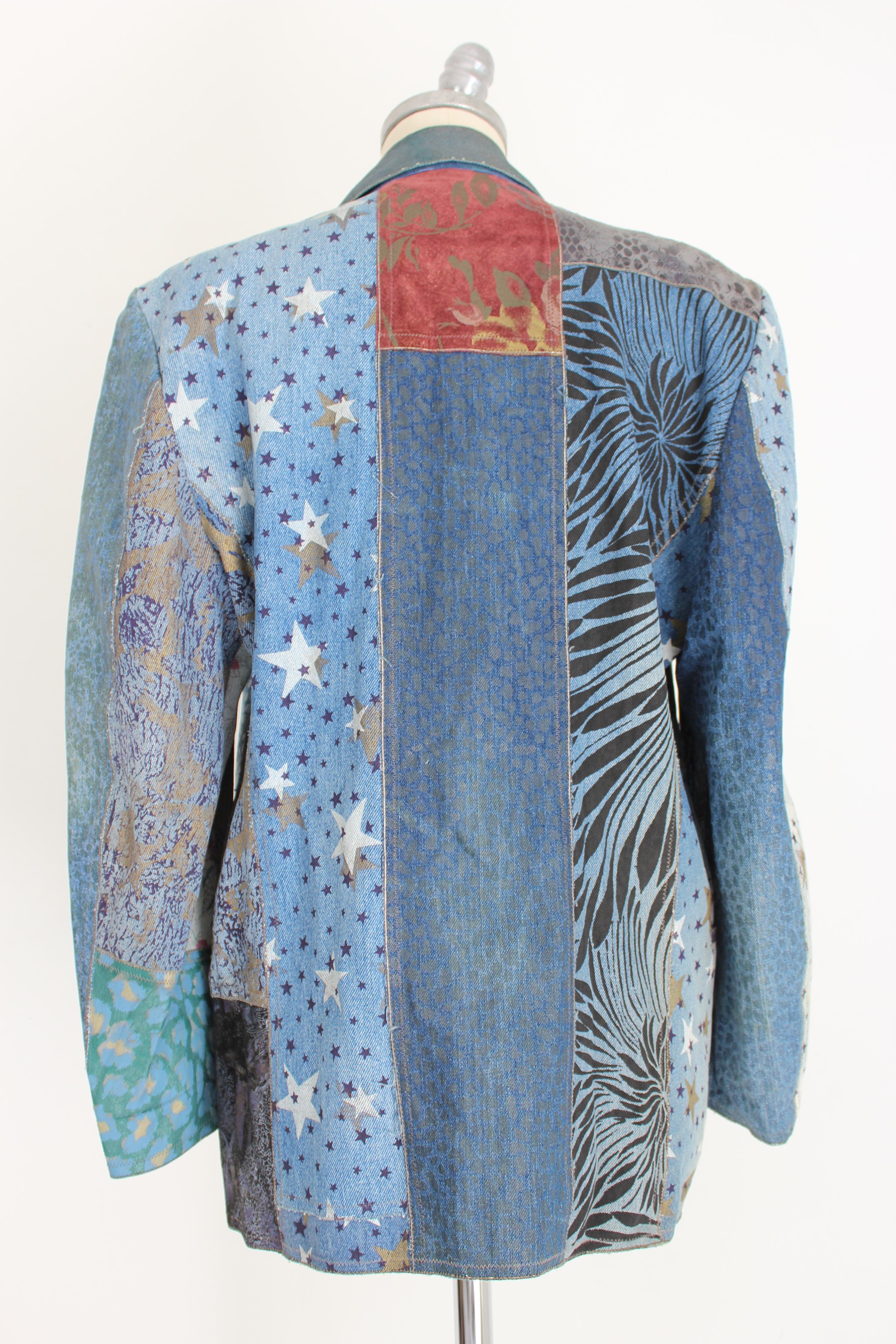 Roberto Cavalli vintage 80s women's jacket. Long model jacket, light blue with gold-colored spotted print and white stars. Clip button closure. Two pockets on the hips. 80% jeans 20% leather. Internal shoulder straps. Made in Italy. Excellent