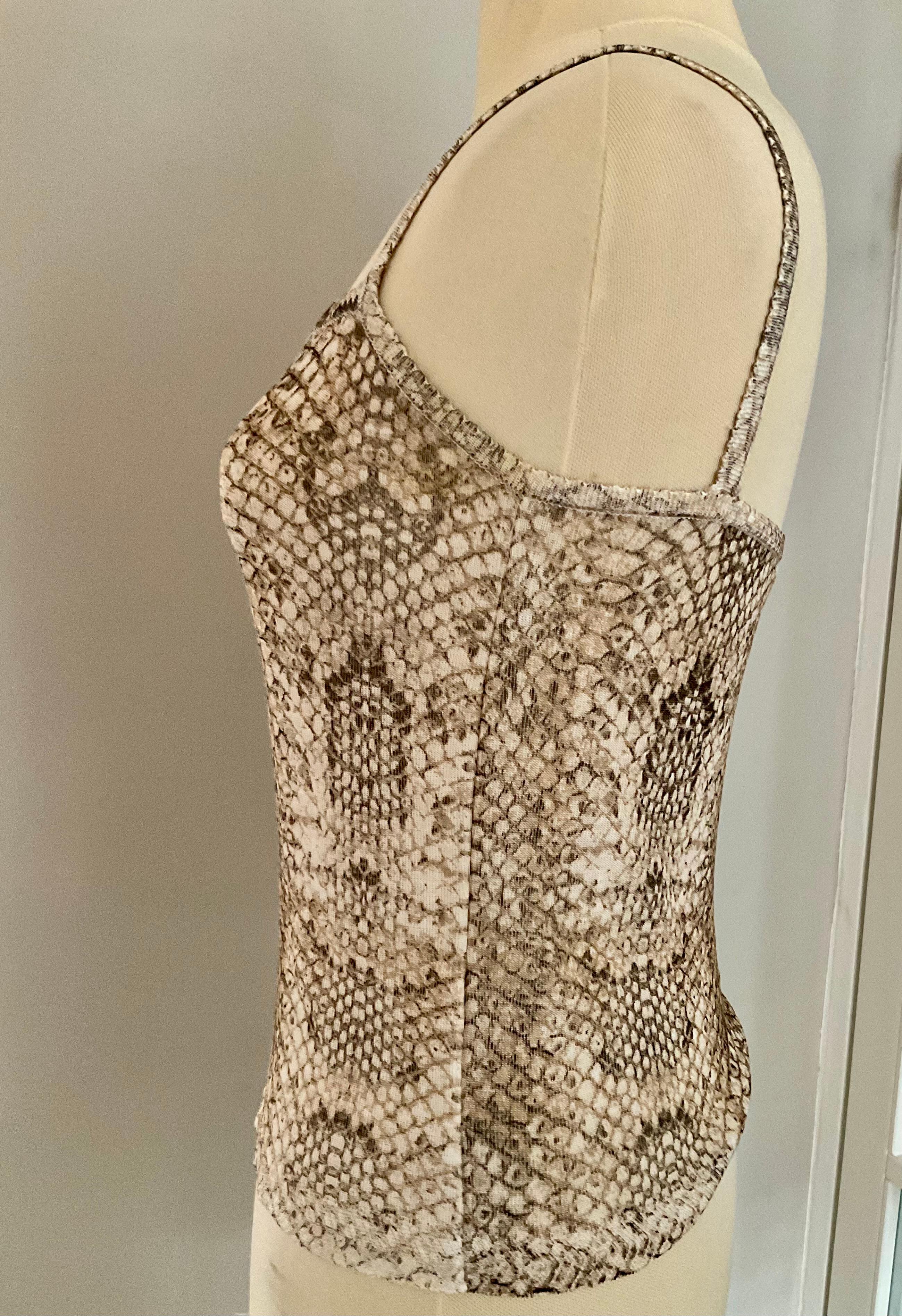 A stunning very rare exceptional vintage piece from the 1990s by Roberto Cavalli, worn by a model. This cami top perfectly captures the designer’s bold and sensual aesthetic. Crafted from a lightweight fabric with Cavalli’s signature snakeskin