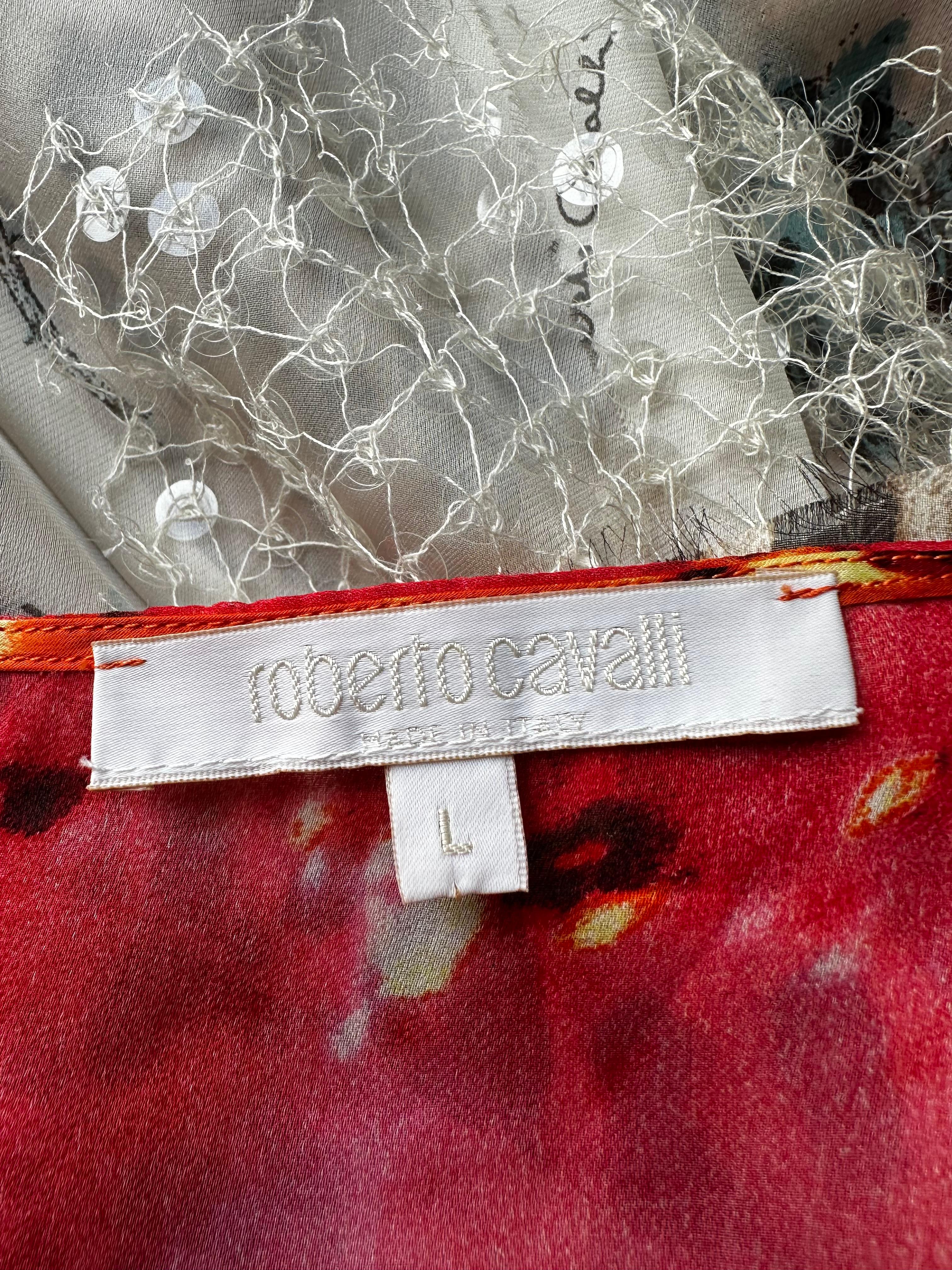 Mini robe en soie Roberto Cavalli 2002 Runway

Ourlet asymétrique et ornements en paillettes 

Bon état vintage, pas de déchirures ni de taches. Usure normale due à l'âge 

Taille sur l'étiquette L mais conviendrait à S/M.
Taille plate environ 14
