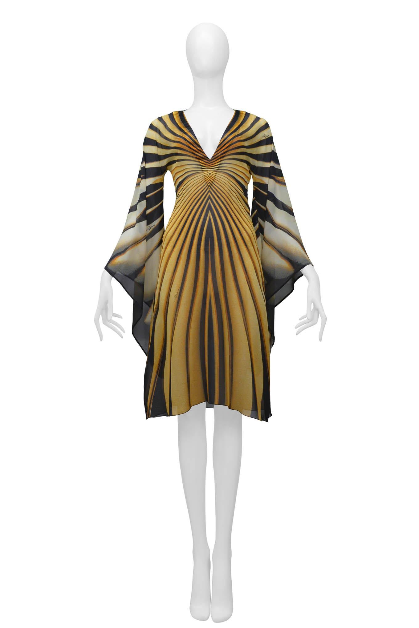 Resurrection Vintage is excited to present a vintage Roberto Cavalli yellow monarch butterfly dress gown featuring a v-neck along the front and back, a tie at the back of the neck, and bell sleeves that replicate the wings of the monarch