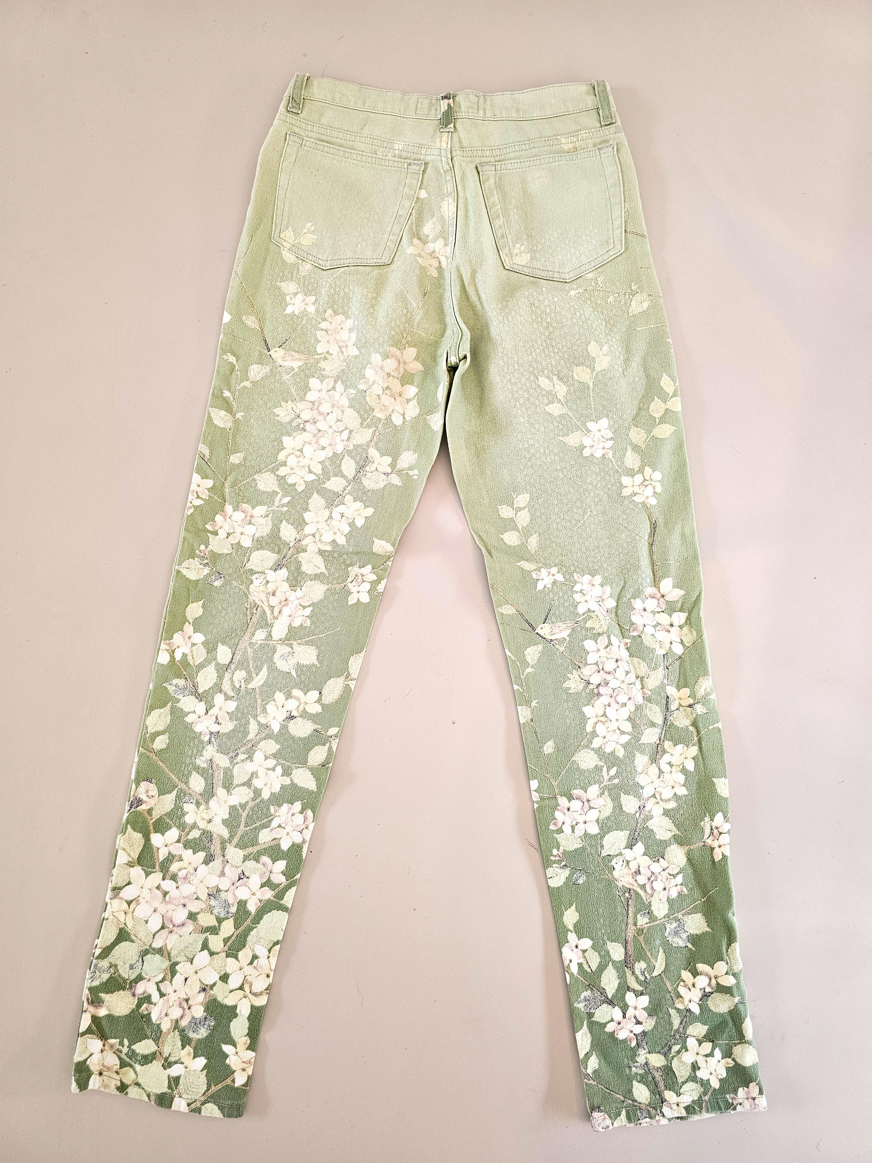Vintage 90s Roberto Cavalli Pale Green Blossom Birds Jeans. 
A Collector’s Dream!

Step into the luxury of the 1990s with these rare Roberto Cavalli Pale Green Blossom Birds Jean; a stunning piece of wearable art that embodies Cavalli’s signature