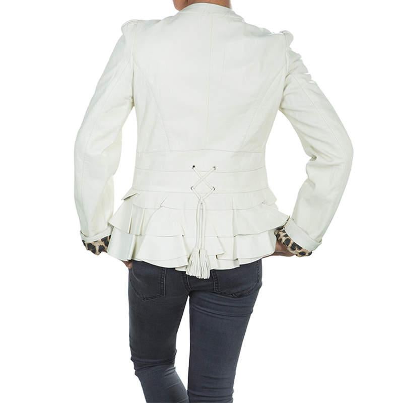 Roberto Cavalli Angels is a brand that can add flair to any design for the little angels. This leather jacket by the brand features a round neckline, long sleeves, a front brand plaque, and hidden closure. The frill detail is an added design element