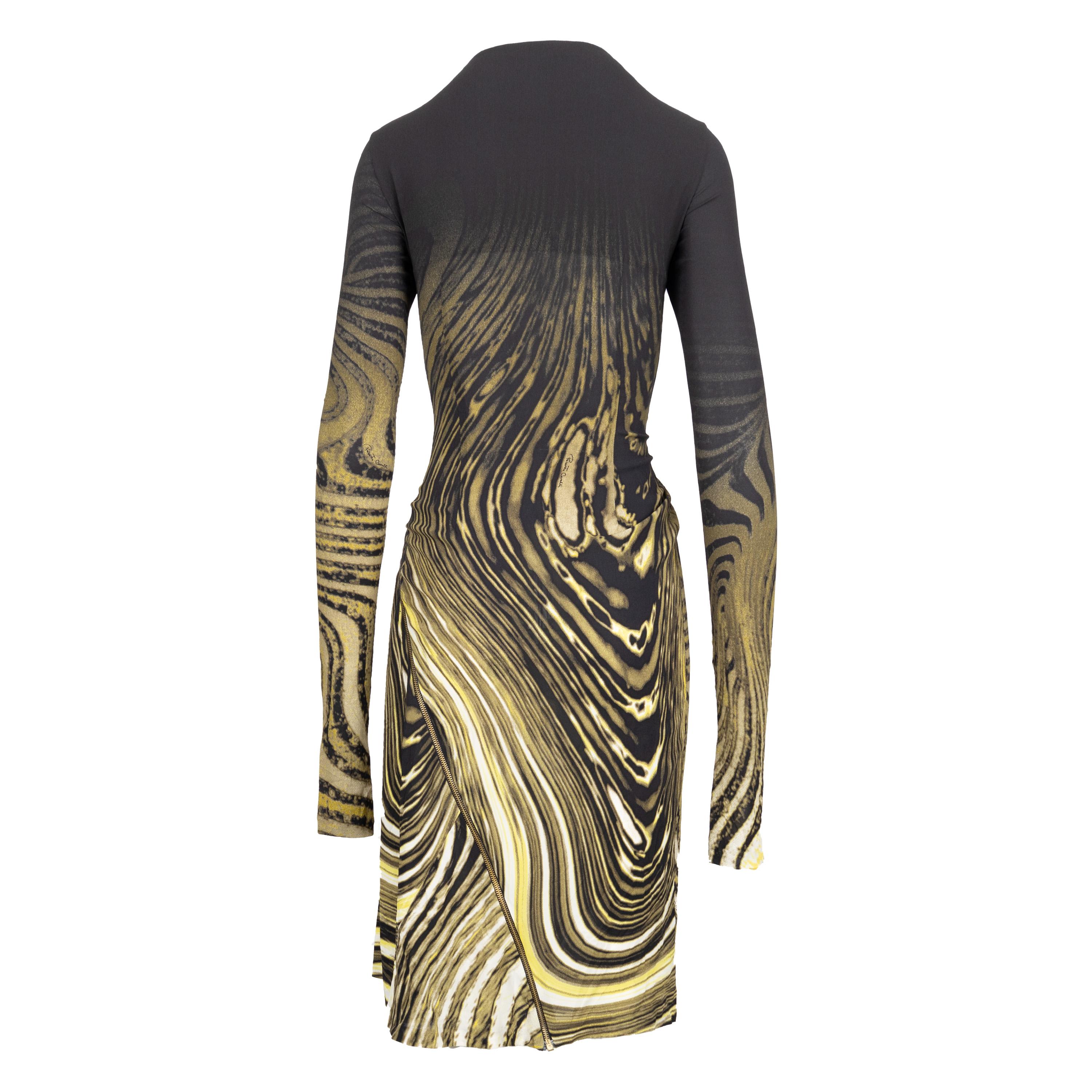 This Roberto Cavalli Animalier Print Dress features a swirl animalier print with a striking black ombre upper, and a gold-toned adjustable front zipper for a versatile look. The long fitted sleeve and form-fitting silhouette provide a flattering fit