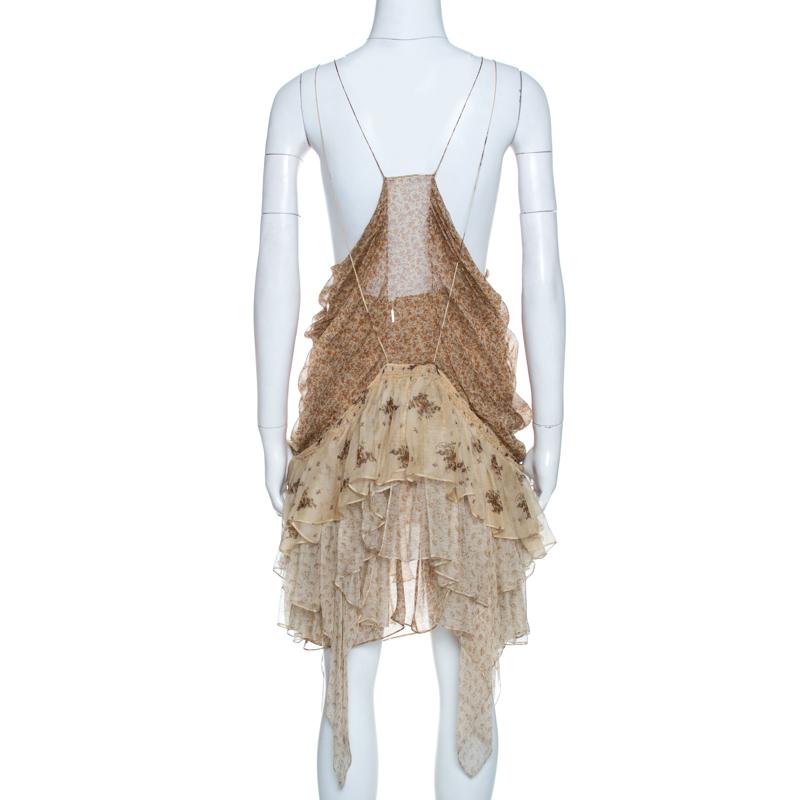 We are singing praises for this cotton dress from Roberto Cavalli as it is well-made and beautiful to look at. It arrives in beige and designed in a tiered style. You may team it with a jacket or top, leather flats or heels and a simple bag.


