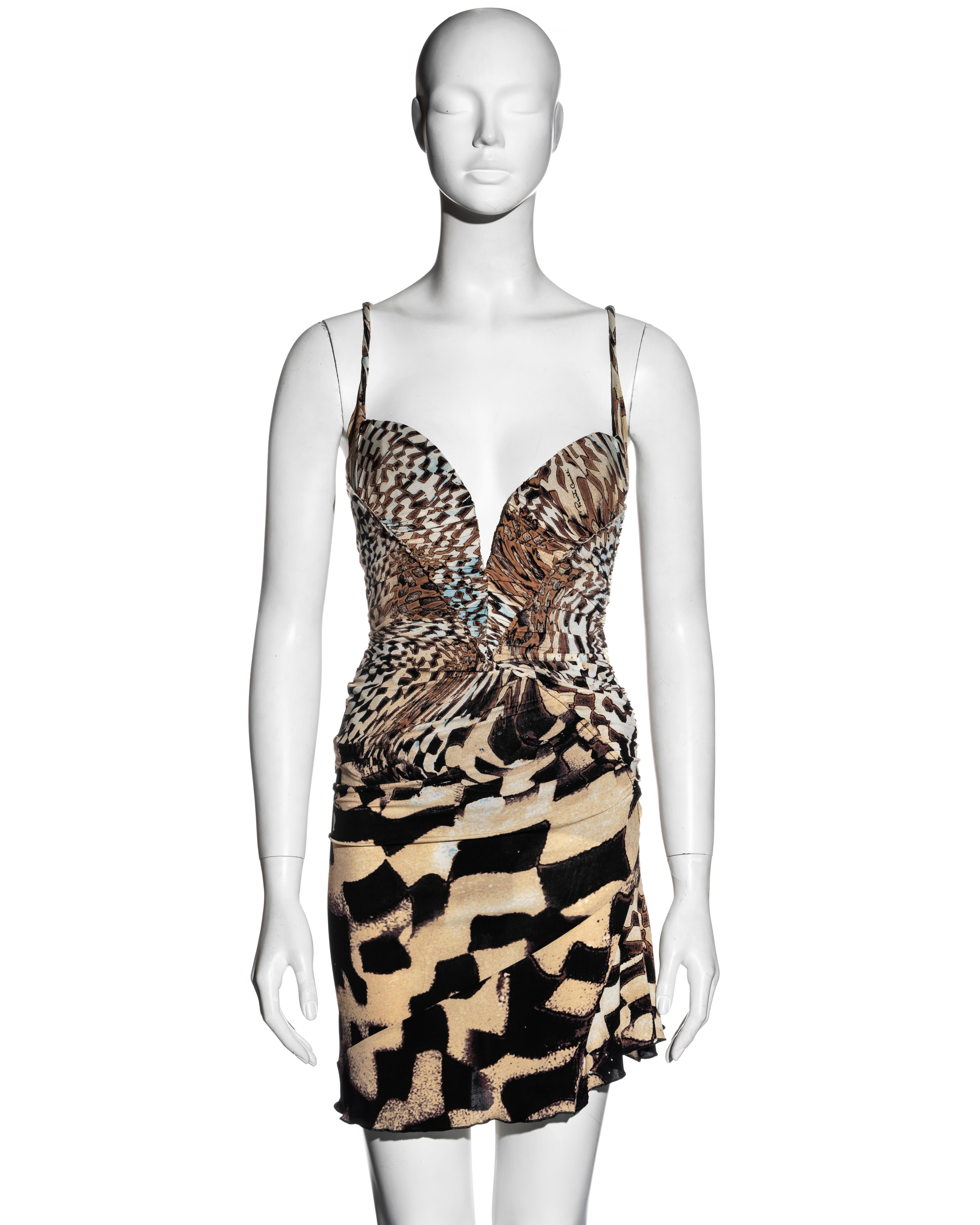 ▪ Roberto Cavalli beige printed silk jersey mini dress
▪ Fall-Winter 2003
▪ Built-in corset, bra and bodysuit 
▪ Ruched bodice 
▪ Rolled shoulder straps
▪ Asymmetric hemline 
▪ Gold-tone metal zipper at the centre-back
▪ Size Small
▪ Made in