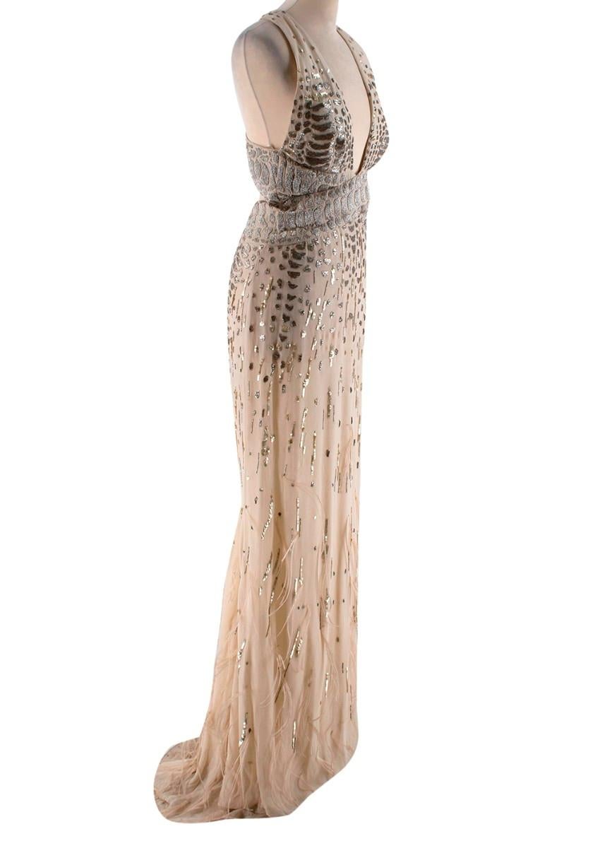 Roberto Cavalli Beige Silk Embellished Feathered Gown

- Sleeveless gown 
- Sequin and beaded embellishment
- Feathered detailing 
- Plunge neckline 
- Eyelet and zip back fastening 
- Cut-away back

Materials: 
Main - 100% silk 
Lining - 100%