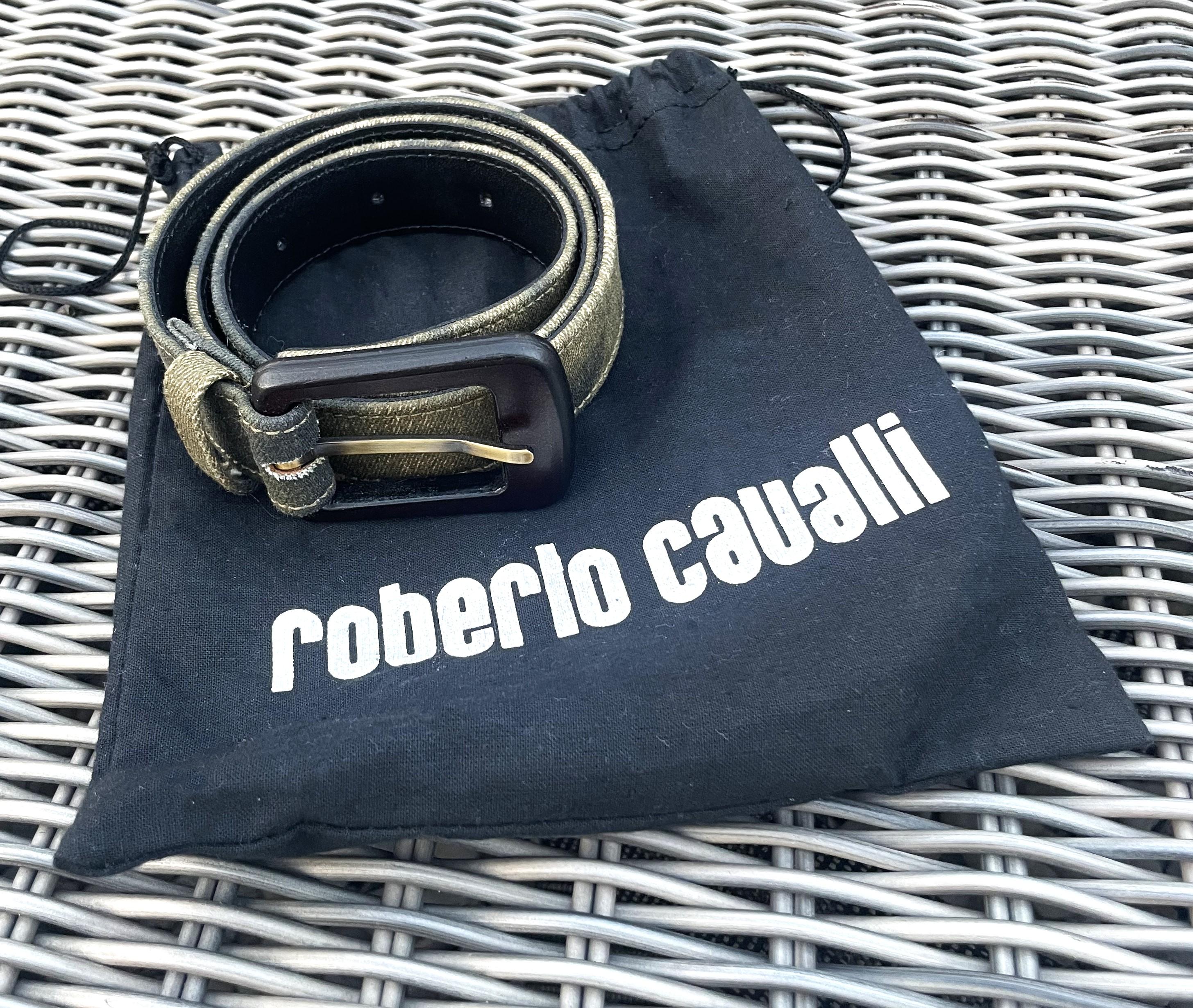 This one-of-a kind animal print belt designed by Roberto Cavalli often feature his signature style, which includes elements like animal prints. Animal prints such as leopard, snake, and zebra are commonly used in his designs, giving his belts a