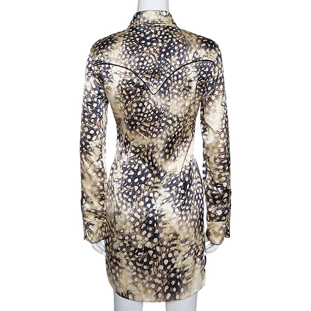 Make a fantastic style statement by pairing this Roberto Cavalli dress with offbeat accessories. It carries a stunning shirt silhouette that can create a faux look of separates when accessorised with a belt. The animal-printed dress is styled like a