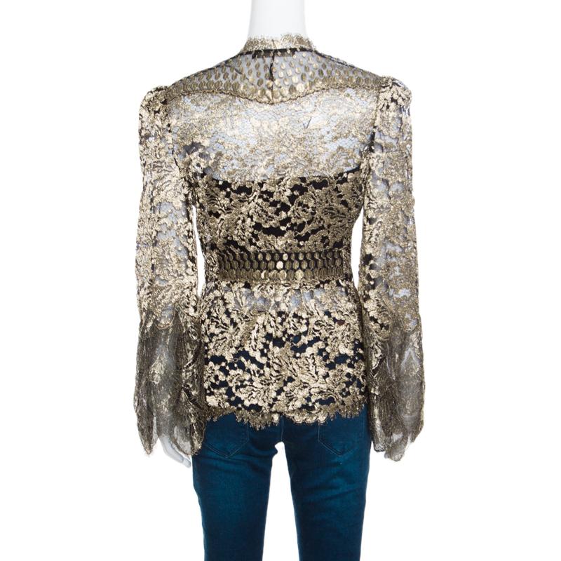 Roberto Cavalli brings you this gorgeous jacket to help you win compliments wherever you go! Shimmering in black and gold, it features a beautiful floral lace design and flaunts scalloped trimmed edges. It comes equipped with front hook fastenings