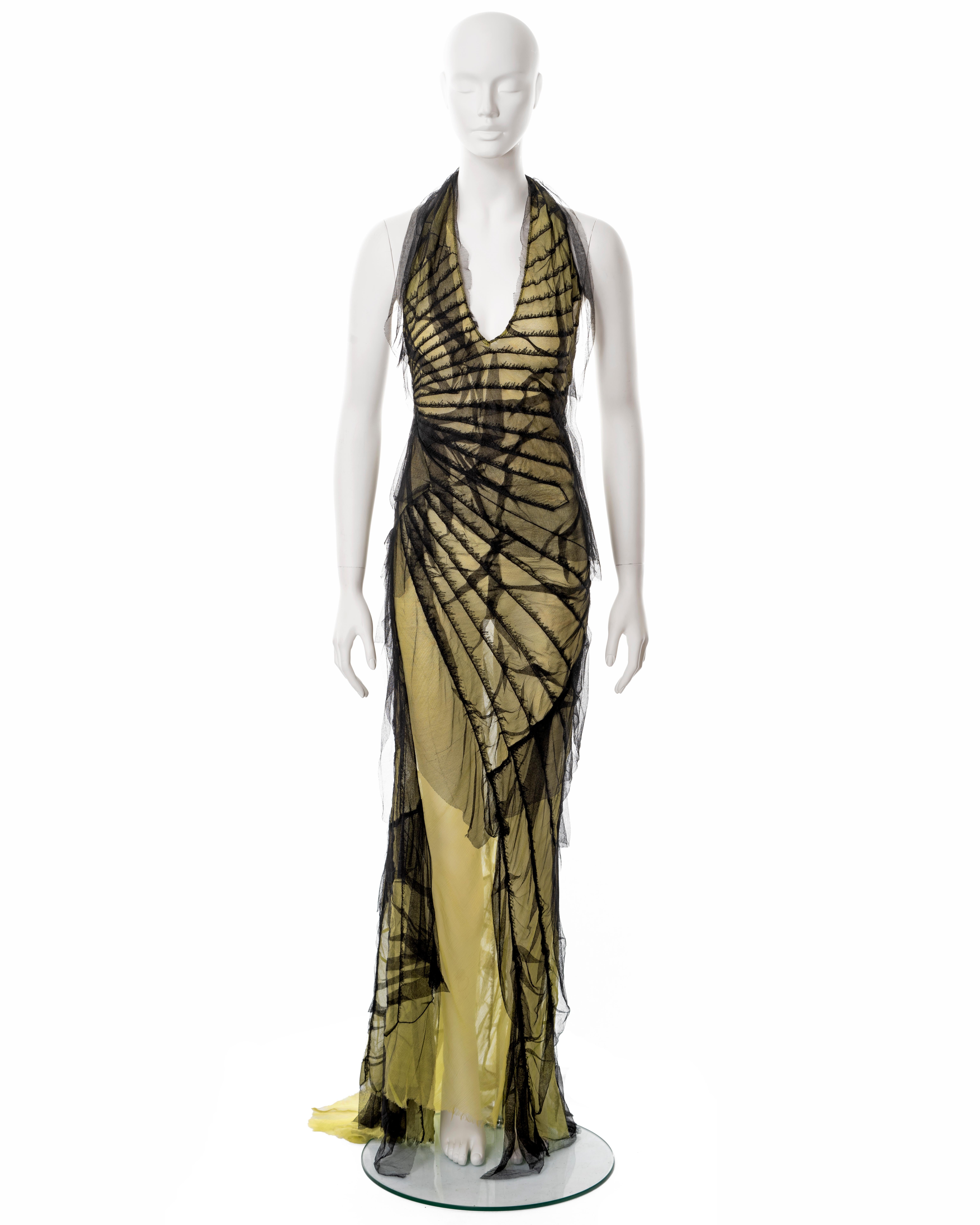 ▪ Roberto Cavalli deconstructed evening dress
▪ Sold by One of a Kind Archive
▪ Spring-Summer 2001
▪ Constructed from shredded black silk net with lime underlay 
▪ Multiple bias-cut panels 
▪ Open low back 
▪ Floor-length skirt with train 
▪ 100%