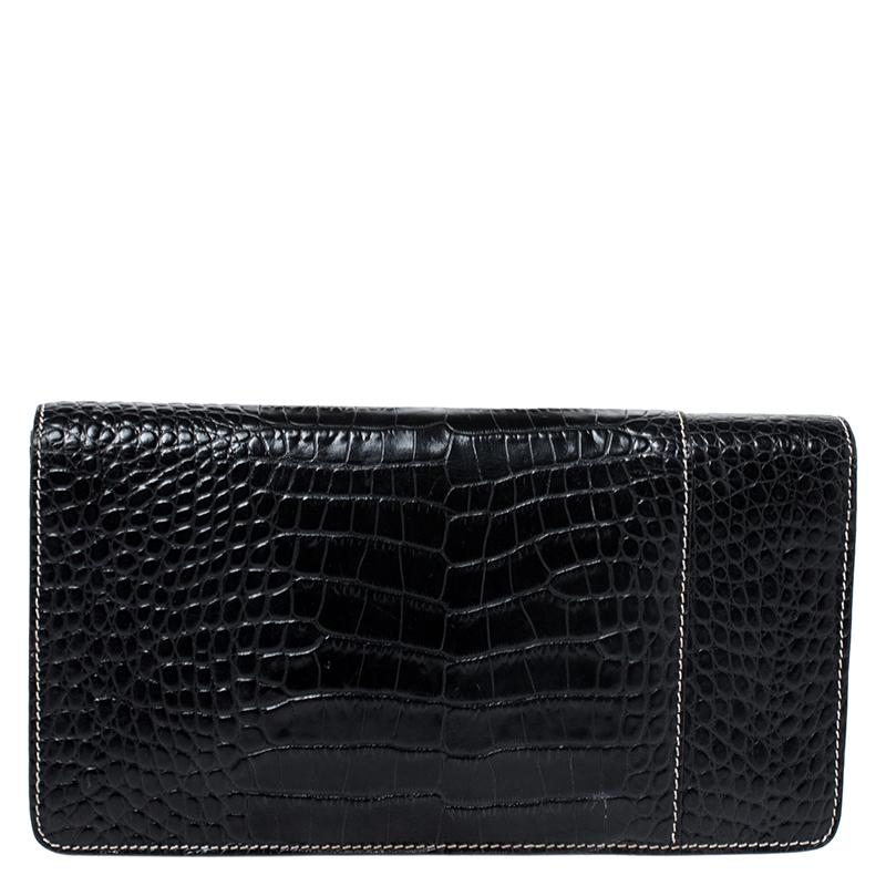 Stunning in a classic black shade, this clutch from Roberto Cavalli is sure to add sparks of luxury to your closet! The clutch is crafted from croc-embossed leather and features a chic silhouette. It flaunts gold-tone brand logo 