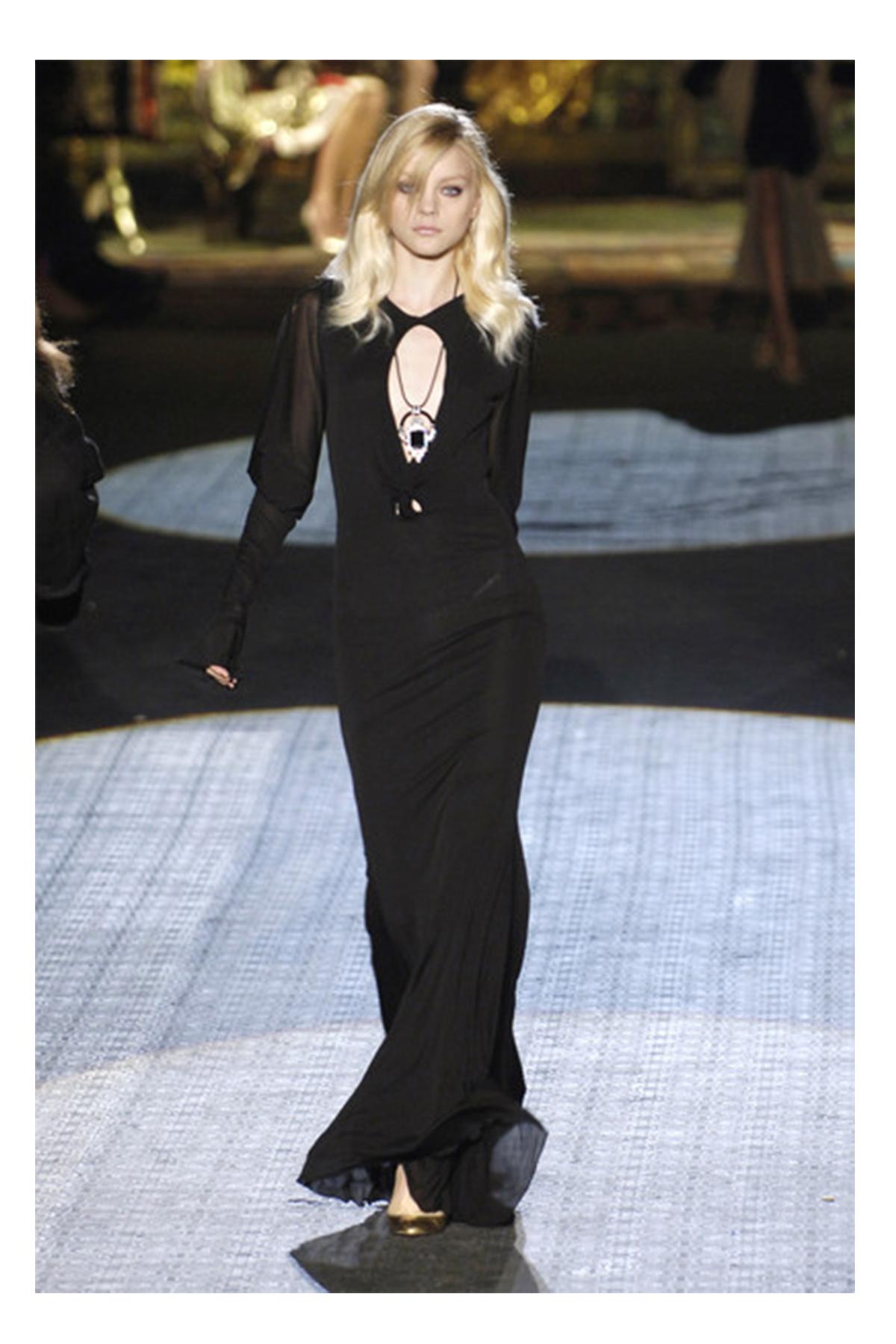 Resurrection Vintage is excited to present a vintage Roberto Cavalli black jersey evening gown featuring front and back keyhole cutouts, keyhole exposed accents at the sleeves, extra long sleeves and gown length. 

Roberto Cavalli
Size: