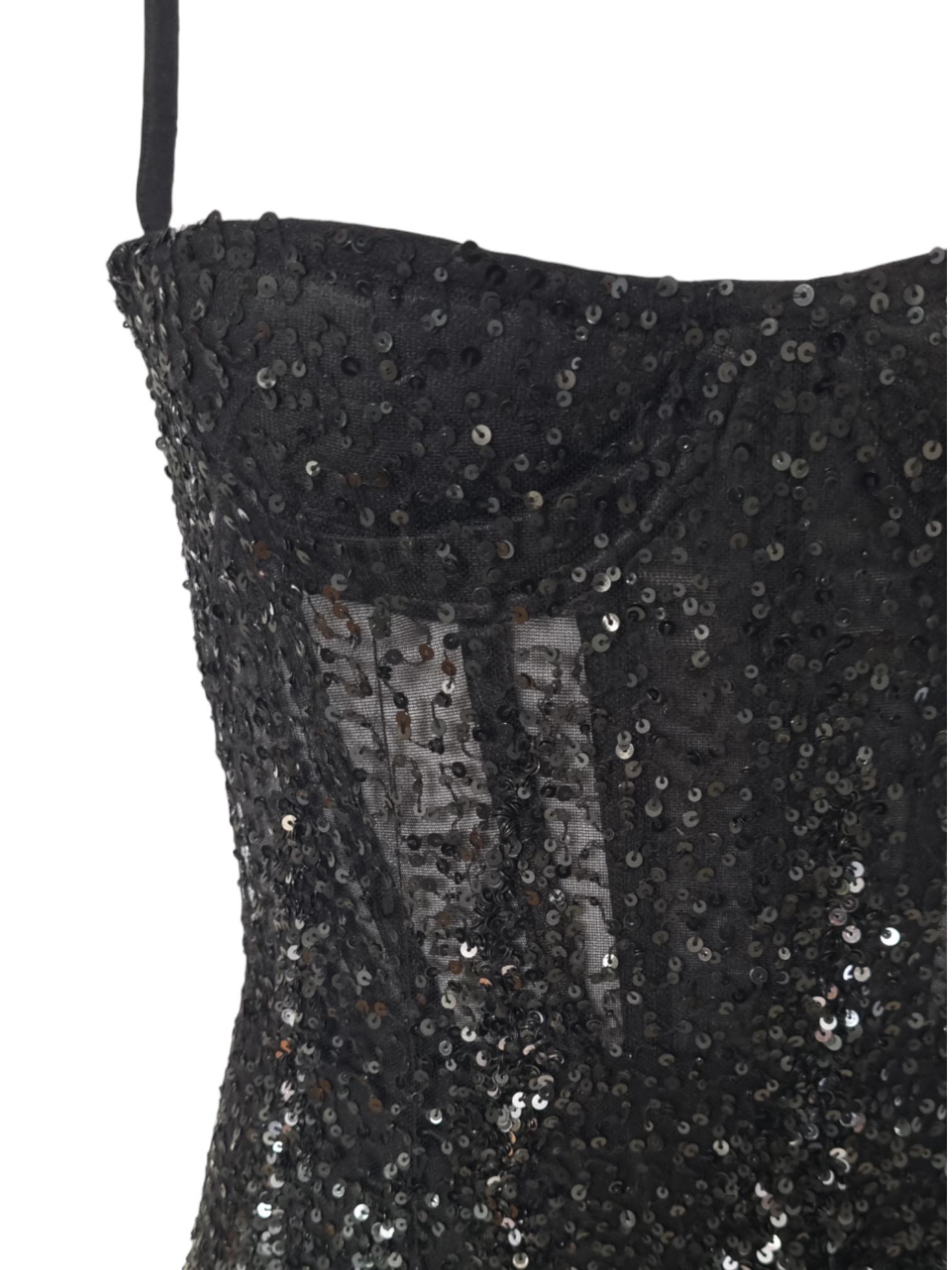 Iconic black beaded runway dress from the Roberto Cavalli SS 2004 collection. The dress features an inbuilt corset and padded bust.

The gold version of the dress was worn by Britney Spears and Scarlett Johanson on the red carpet in 2004 and is