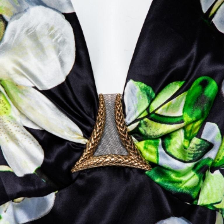 If you're looking for a unique dress, you cannot go wrong with this Roberto Cavalli creation. Opt for this dreamy black satin dress when you go out for a casual dinner. This sleeveless dress is complete with a pretty floral print all over.
