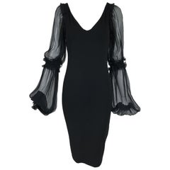 Roberto Cavalli Vestido de punto negro con mangas de gasa negra