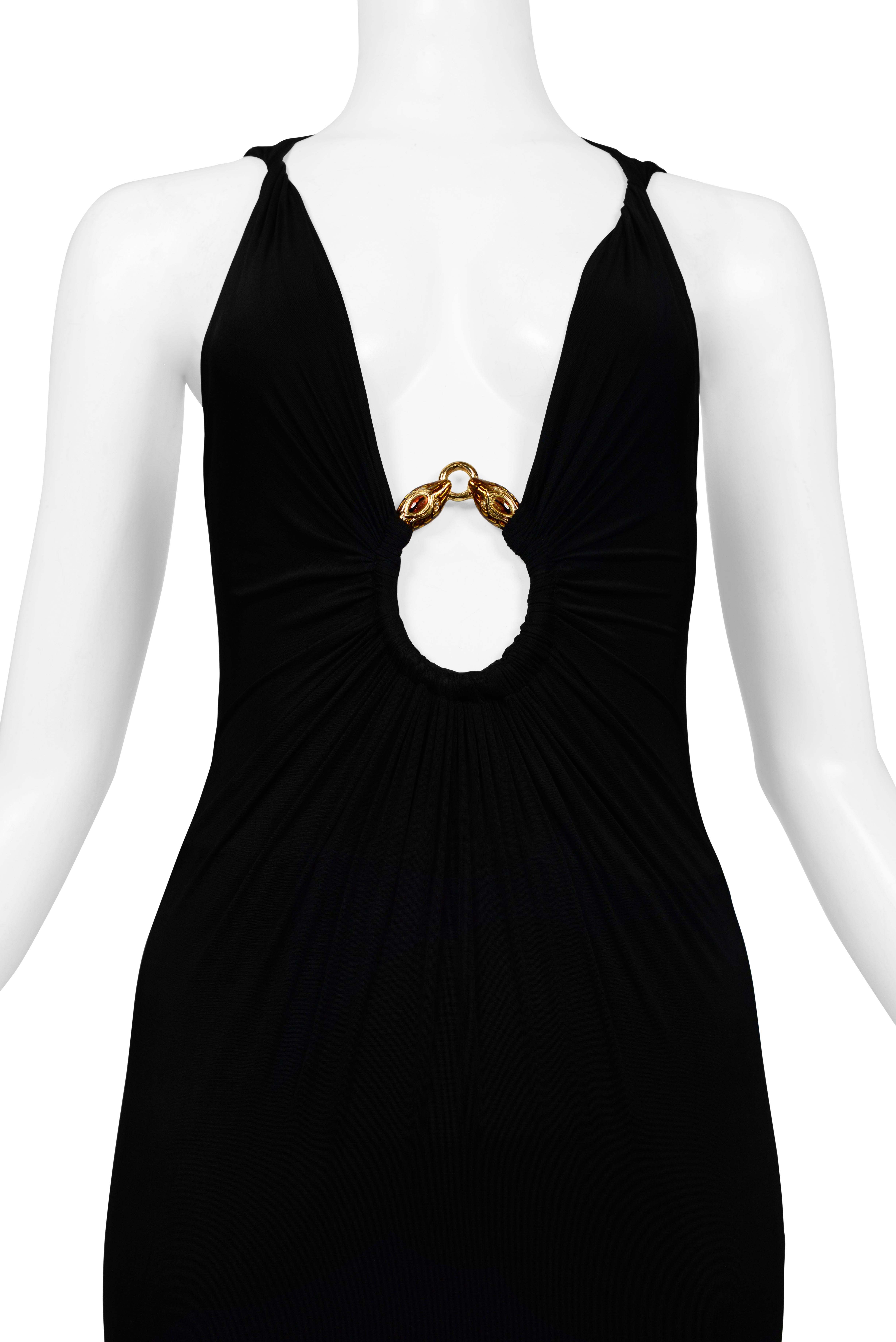 Resurrection Vintage is excited to offer a vintage black Roberto Cavalli gown featuring a deep v-neck with a gold snake head ring adorned with jewel detail, twisted shoulder straps, slinky fit, and dramatic evening gown length.

* Roberto Cavalli
*