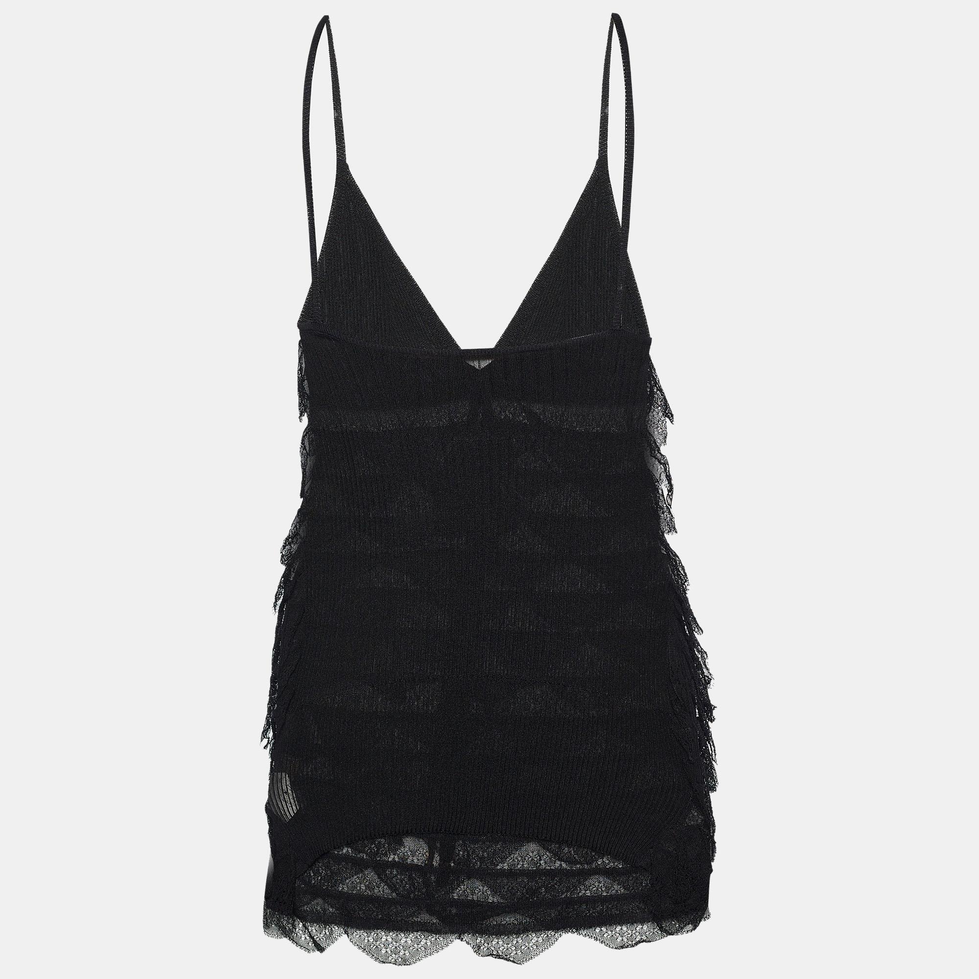 This stunning black top is truly gorgeous and perfect for those evening dinners! Made skillfully from lace, the Roberto Cavalli creation flaunts a flattering frill-detailed silhouette with a V-neckline and is sleeveless. Pair it with skirts or