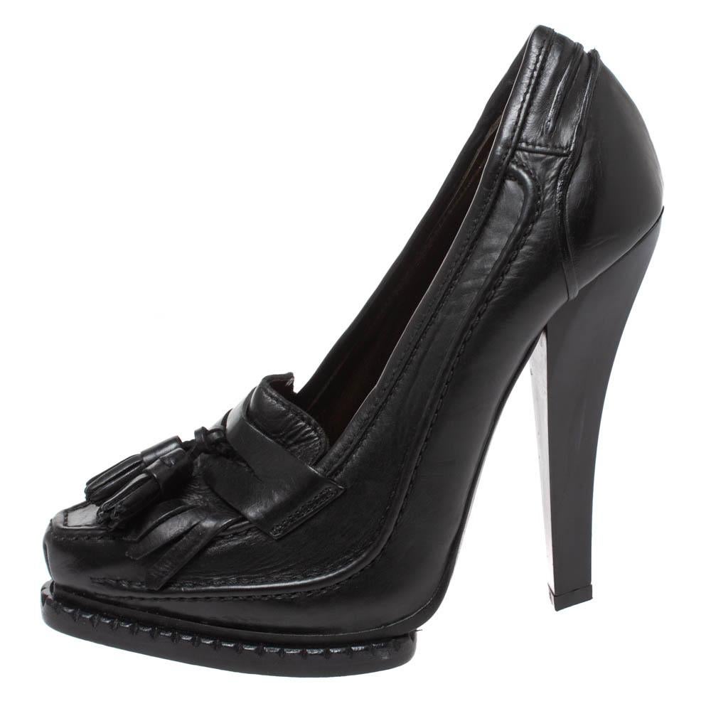 Comfortable and high on style, this pair of loafer pumps by Roberto Cavalli will make you look fabulous every time you step out in them. The black pumps are crafted from leather and feature fringe and tassel details, comfortable insoles and 13 cm