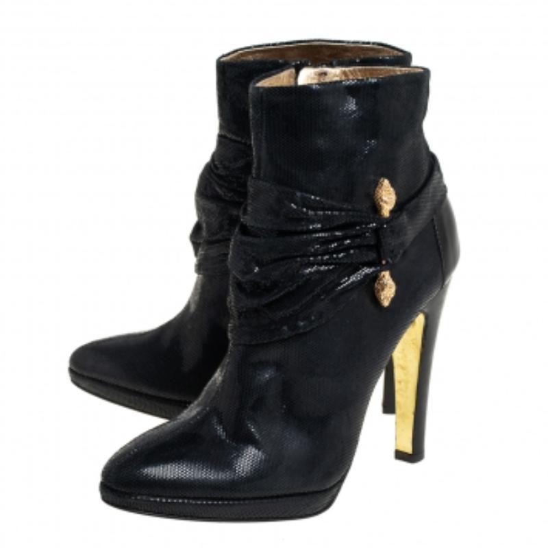 Crafted from nubuck in a black shade, these Roberto Cavalli boots are simply gorgeous! They are designed into an almond-toe silhouette and feature gold-tone hardware and pleated detail around the vamps.