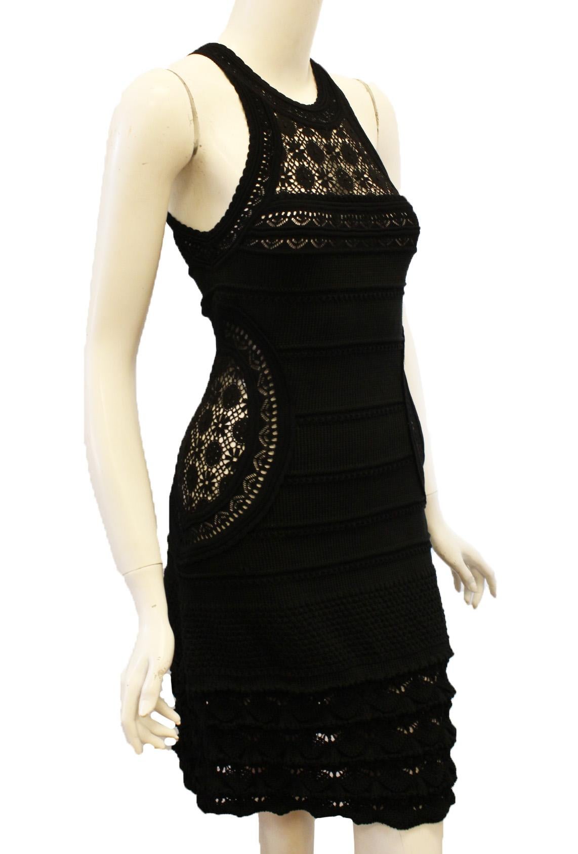 Roberto Cavalli black cotton open crochet sleeveless dress is fantastic for the summer days and night.  Artistically designed and crafted for ease and fashion.  The hem is scalloped and finishes the multi tier ruffles along hemline.  The front and