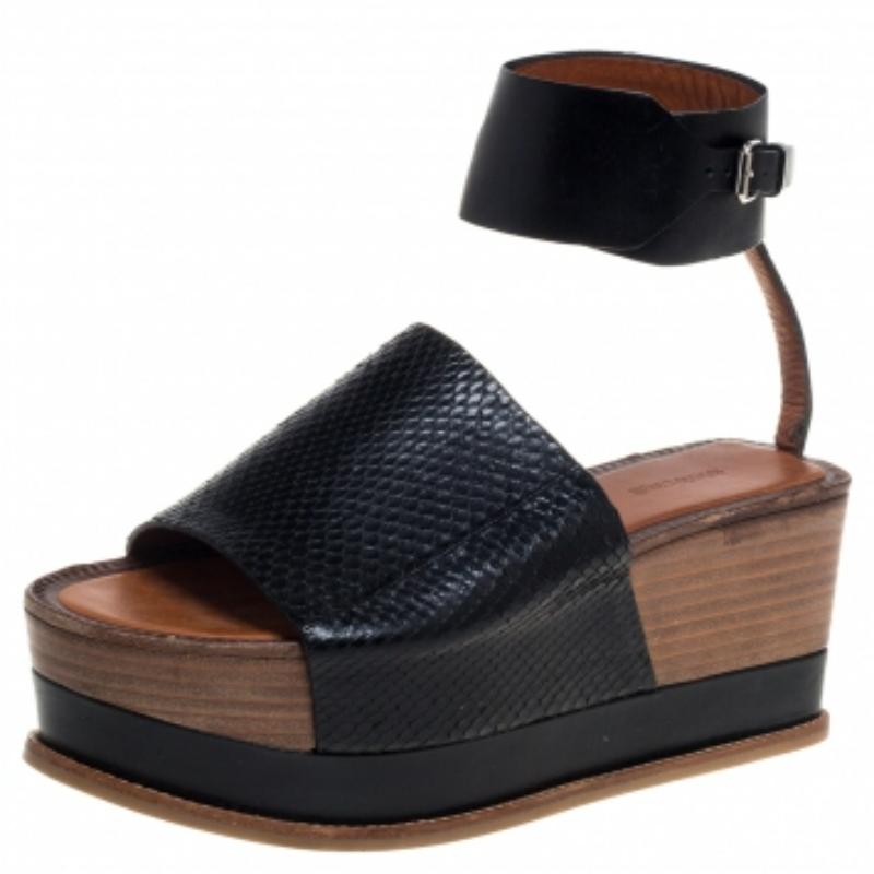 These sandals from Roberto Cavalli are absolutely amazing! They are crafted from black python leather and styled with wide vamp straps and ankle cuffs with buckle fastenings. They come equipped with comfortable insoles and stand tall on 7 cm solid