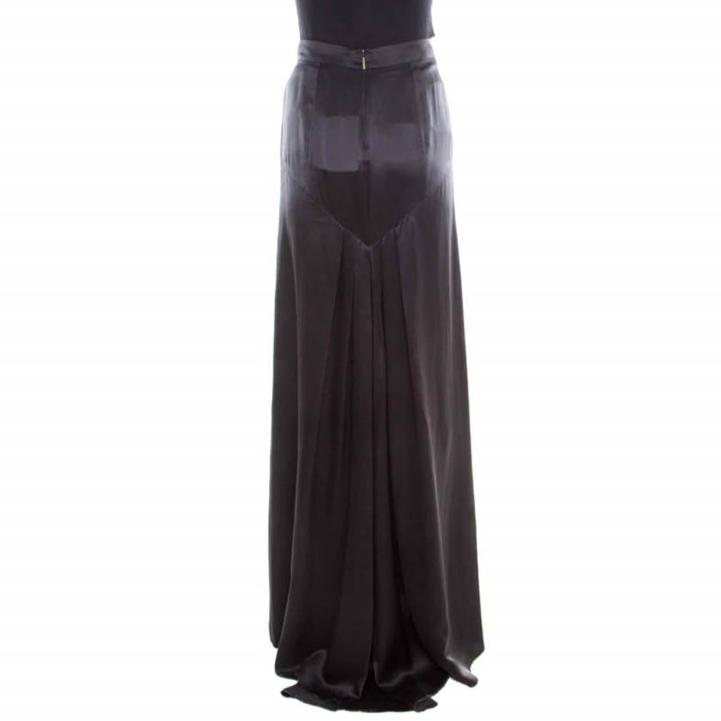 From Roberto Cavalli comes this maxi skirt crafted in a straight silhouette with flattering floor-sweeping length. It is adorned with a classic black hue and features a subtle pleat detail at the bottom rear. It is crafted from silk and will look